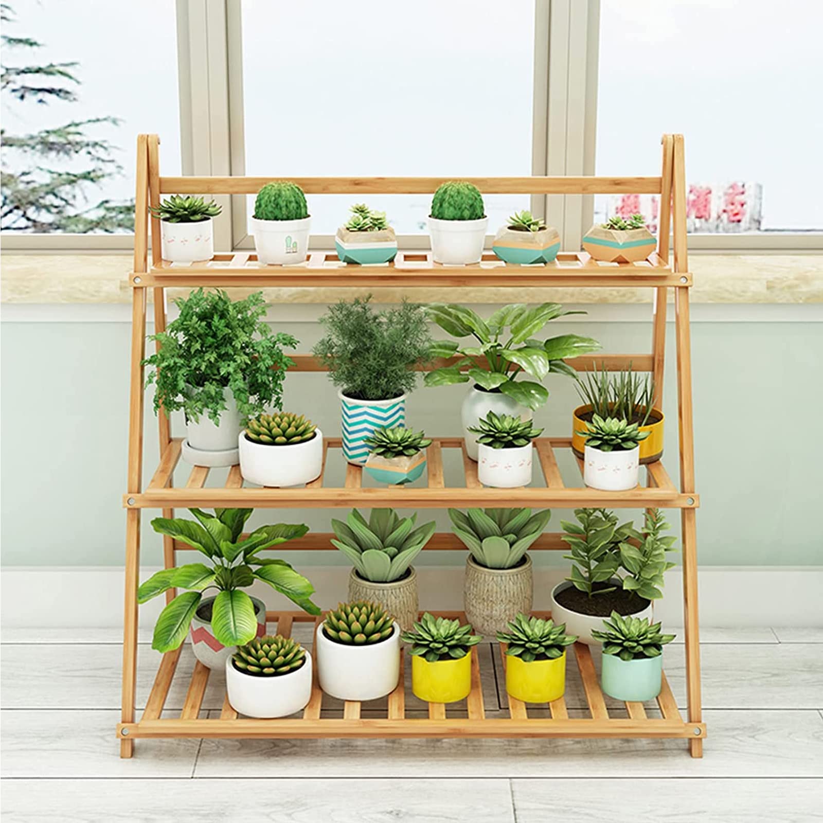Support de plantes pliable en bambou pour gagner de la place sur le balcon fermé