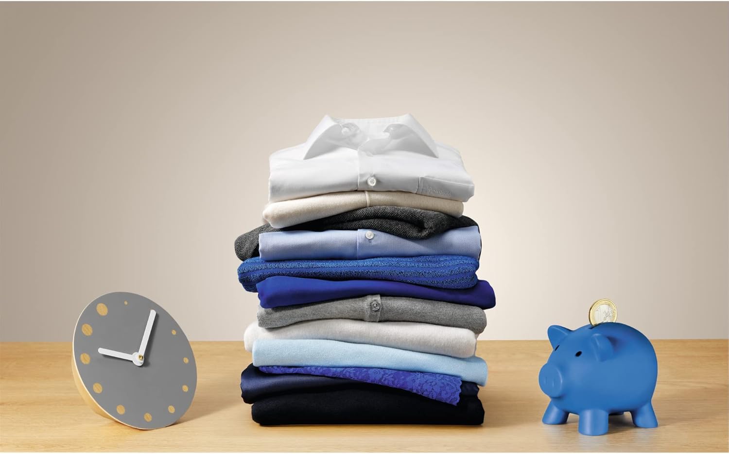 Laundry pile with clock and piggy bank