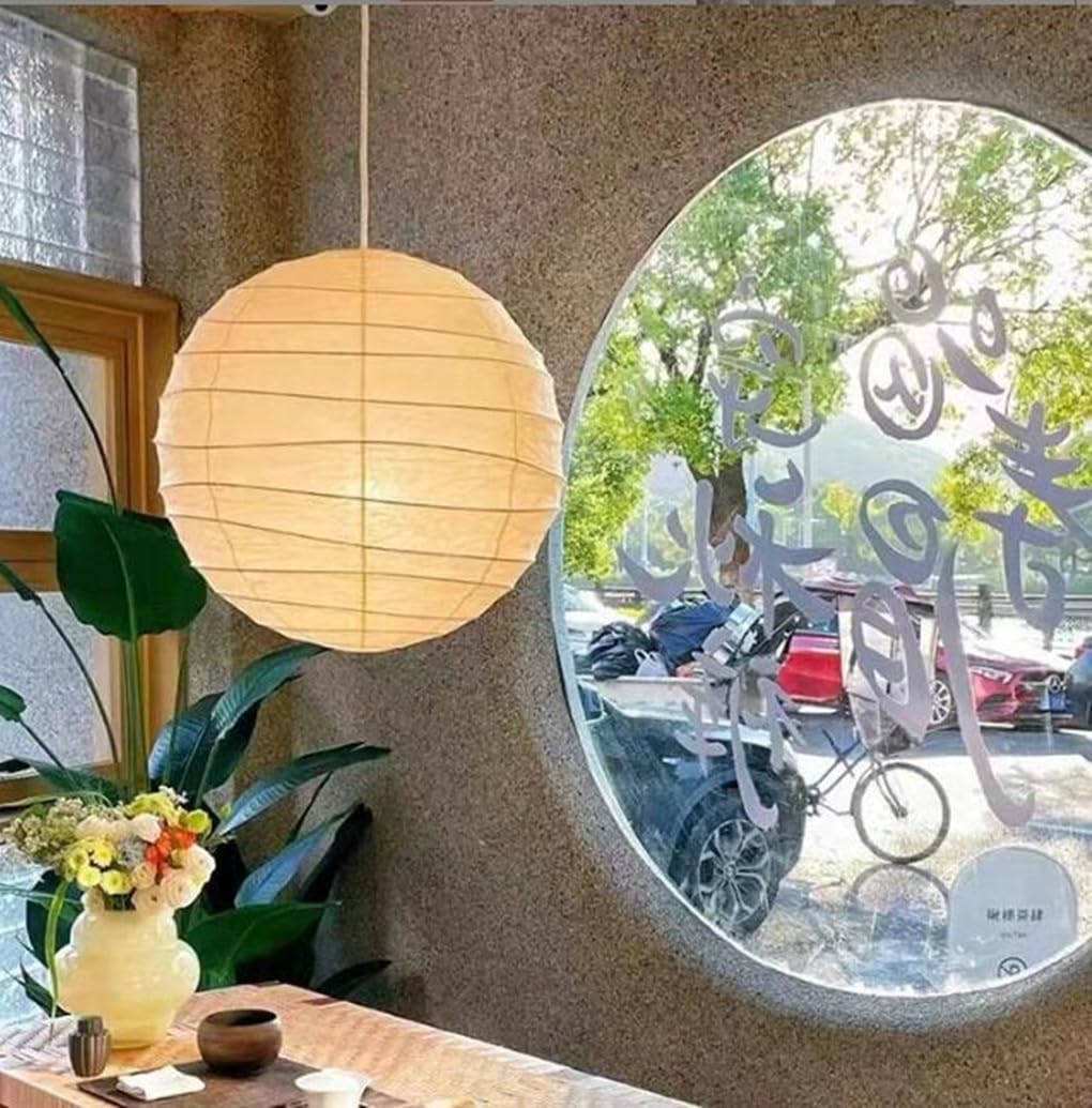 Plafonnier vintage contre la lumière agressive : suspension japonaise en papier pour salon serein