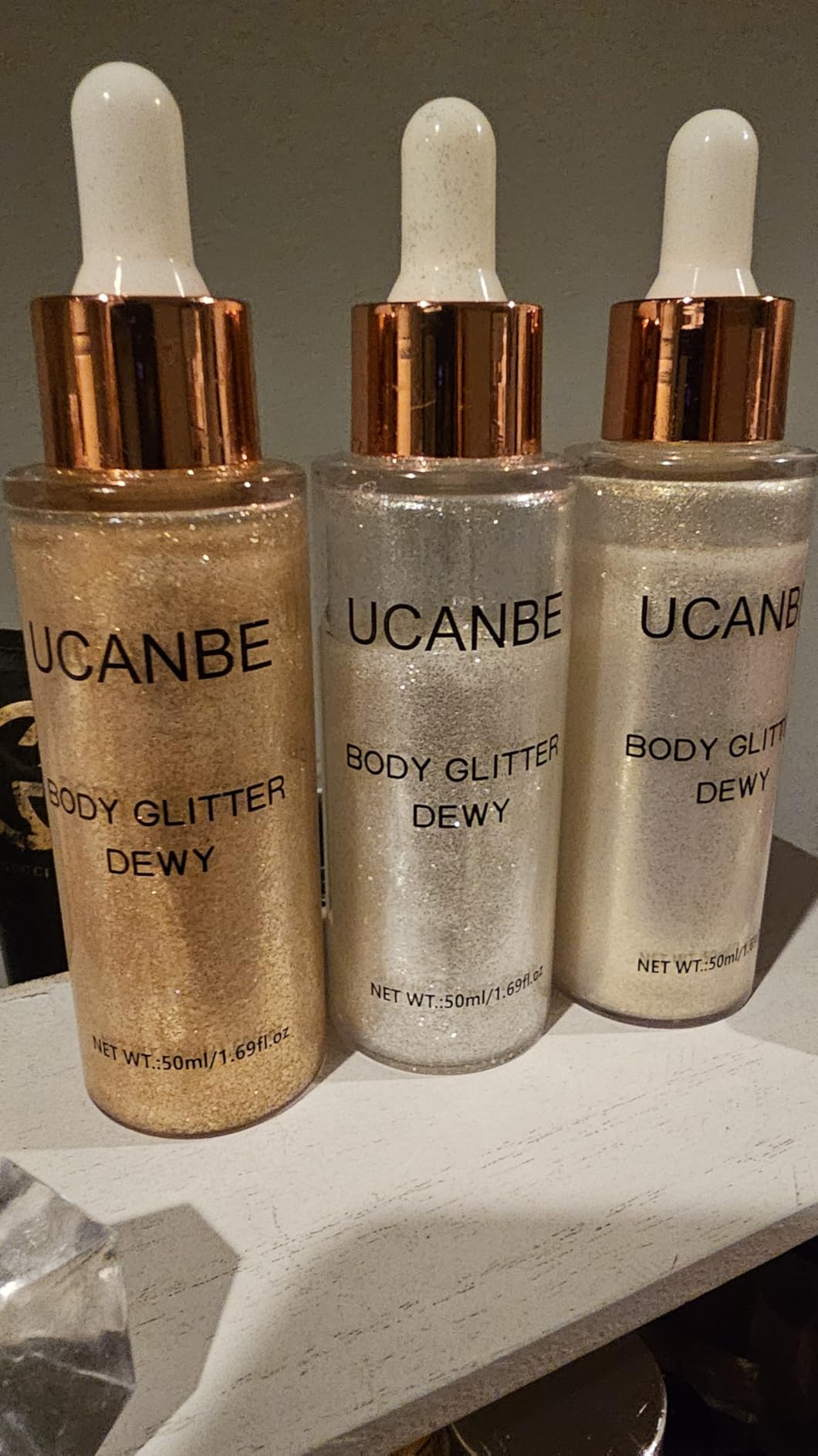 UCANBE Hydrating Body Glitter Dewy Highlighter Makeup Luminizer Drops Body Shimmer Liquid Face Glow Sparkles for Women Gifts (Rose Gold - 03)