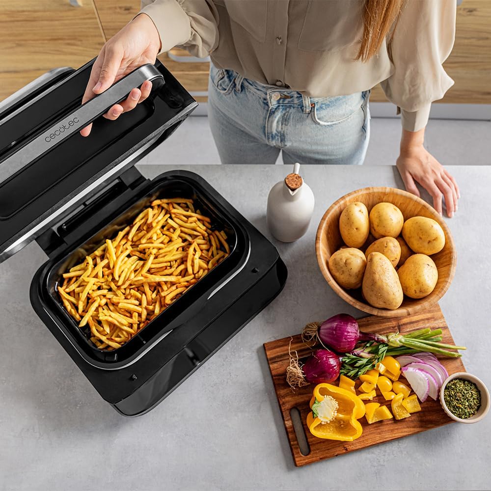 Crispy golden fries in the air frying basket of the Cecotec Air Fryer Grill
