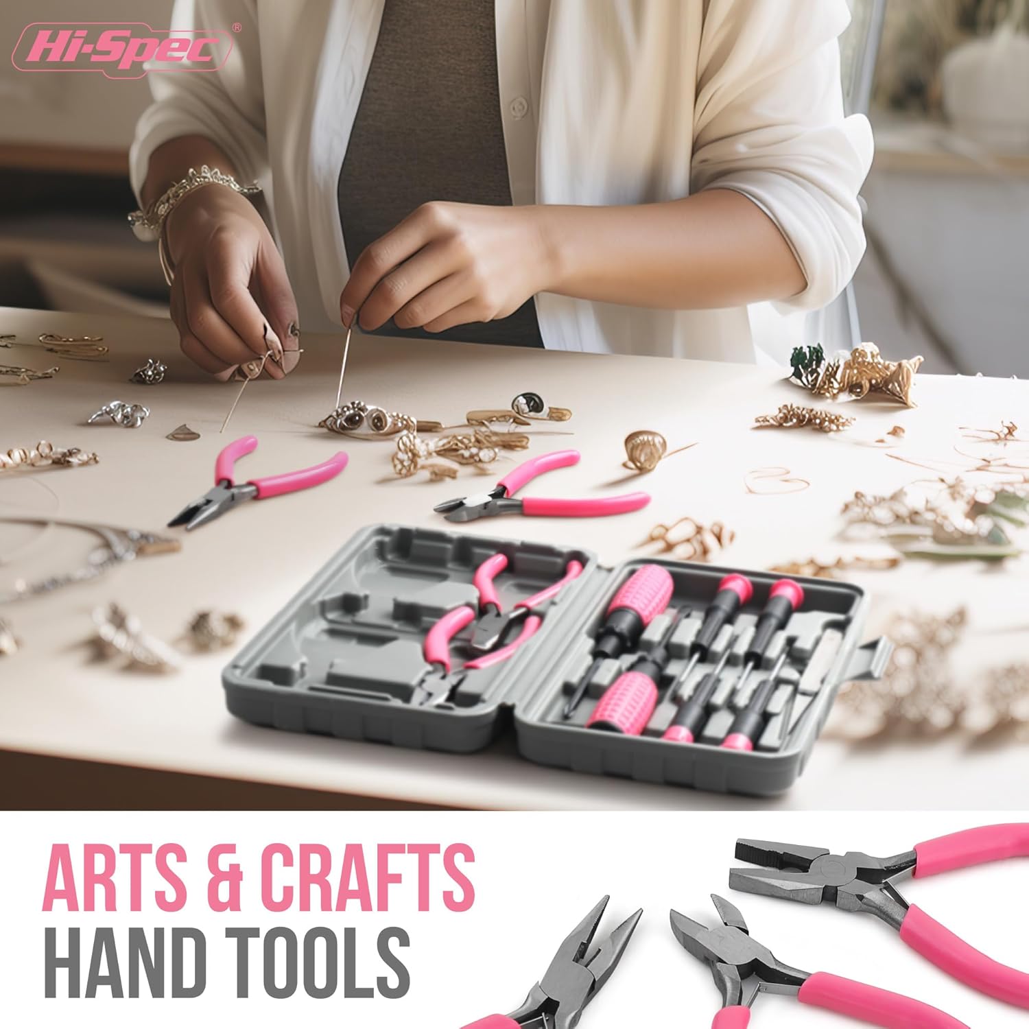 A person using the pink hand tools for a crafting project, demonstrating their application for delicate work.