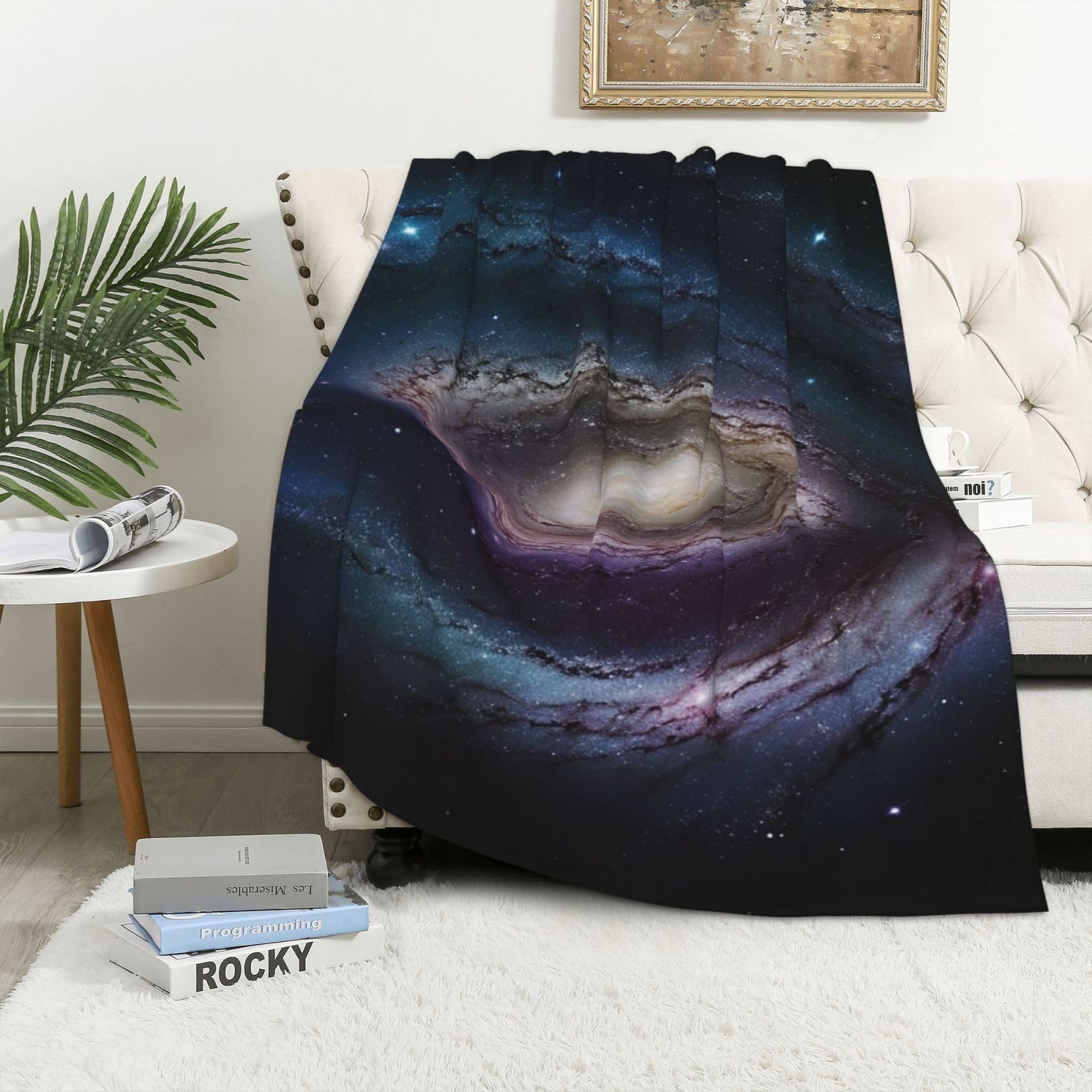 Couverture polaire galaxie pour des soirées canapé cocooning
