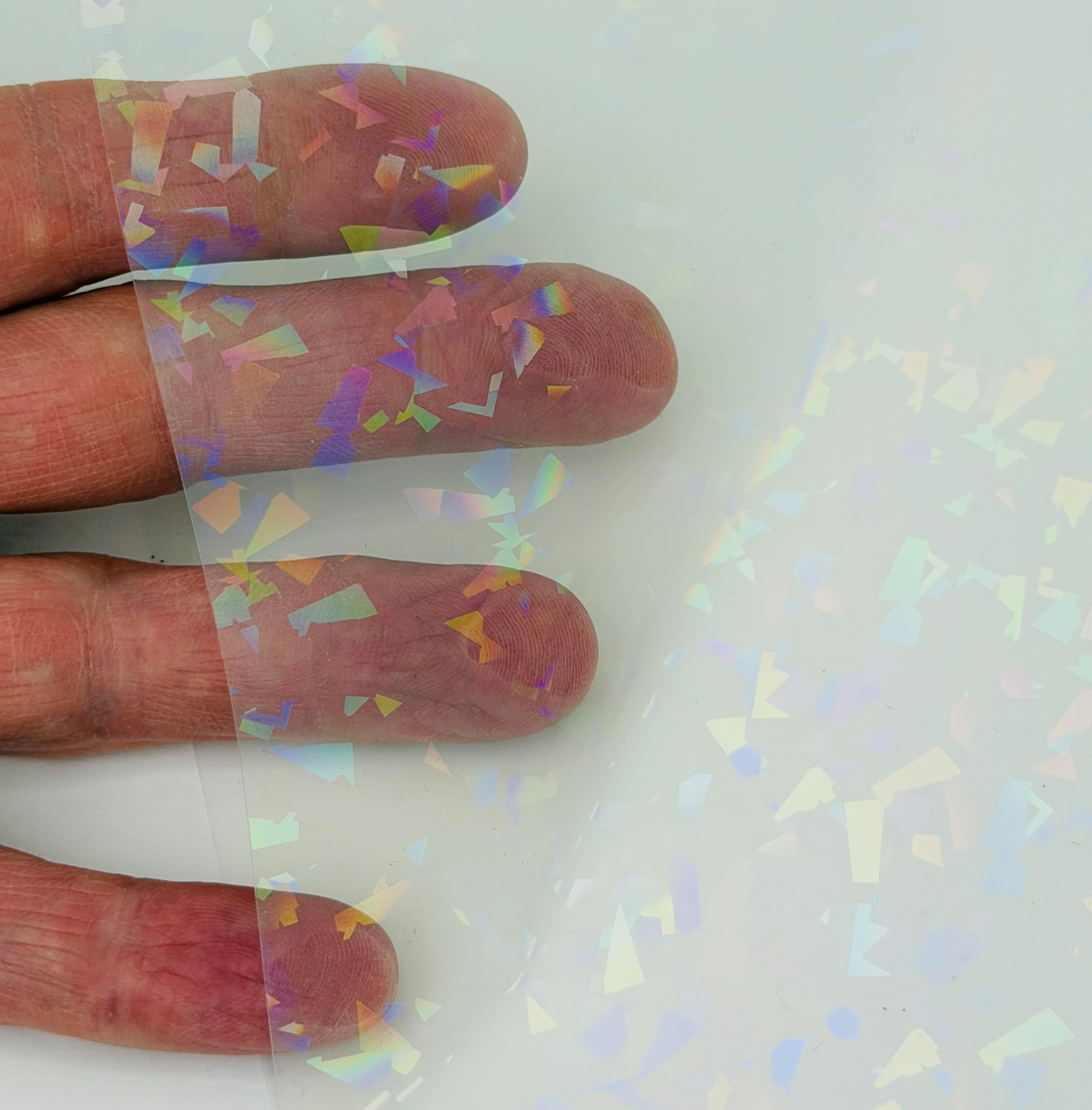 Transparent Crystal Holographic Overlay, Lamination Grade HoloCrystal. This Holographic Laminate Film is Great for Decorating Objects. Often Used Over Artwork, Cards and Other Printed Material