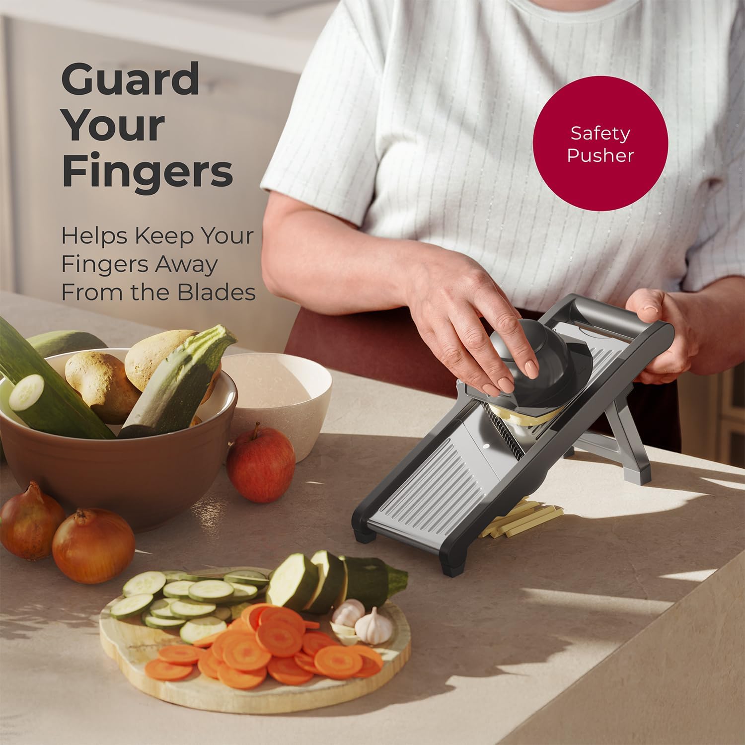 Hand using safety pusher on mandoline slicer