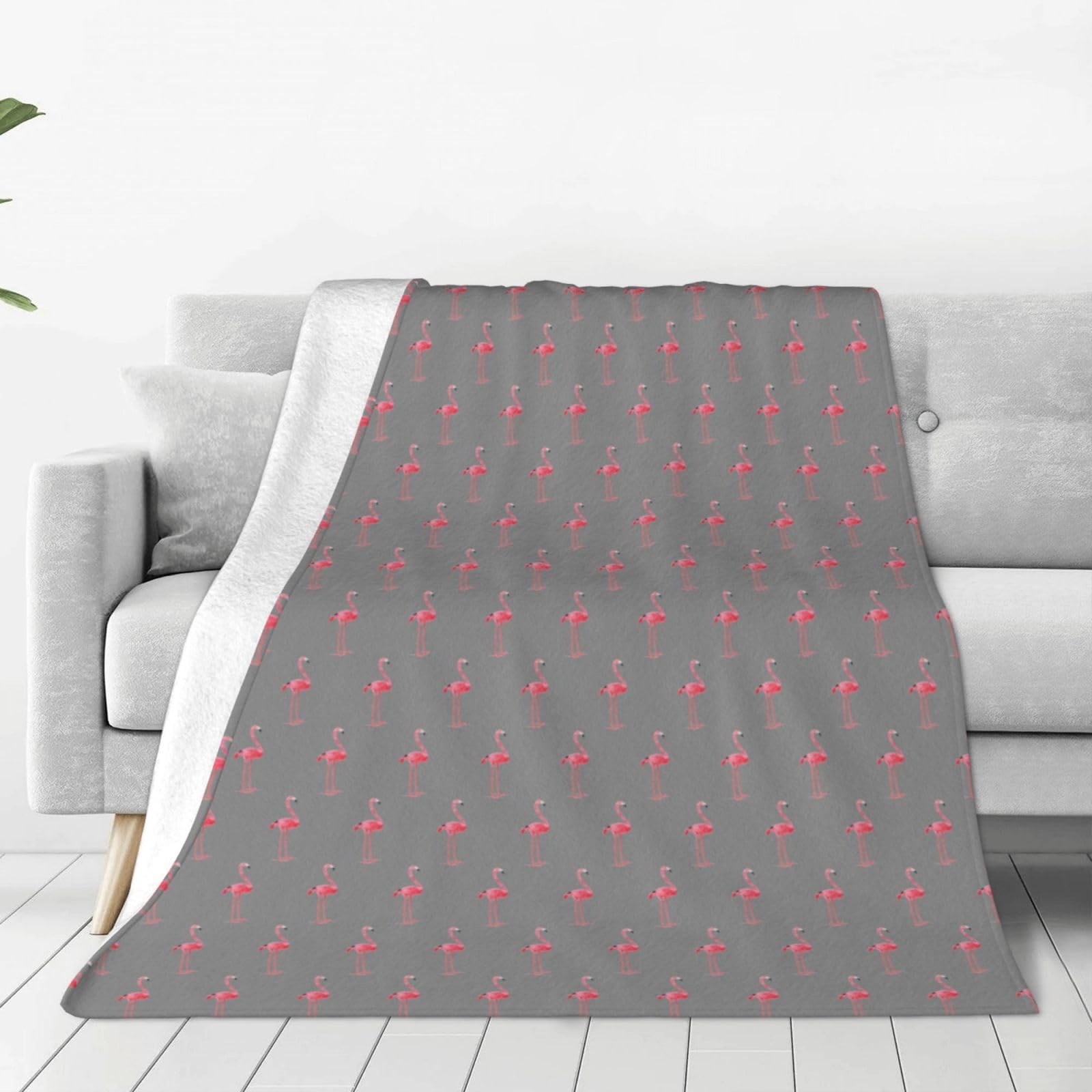 Couverture flanelle flamant rose : finis les frissons sur le canapé avec ce plaid chaud