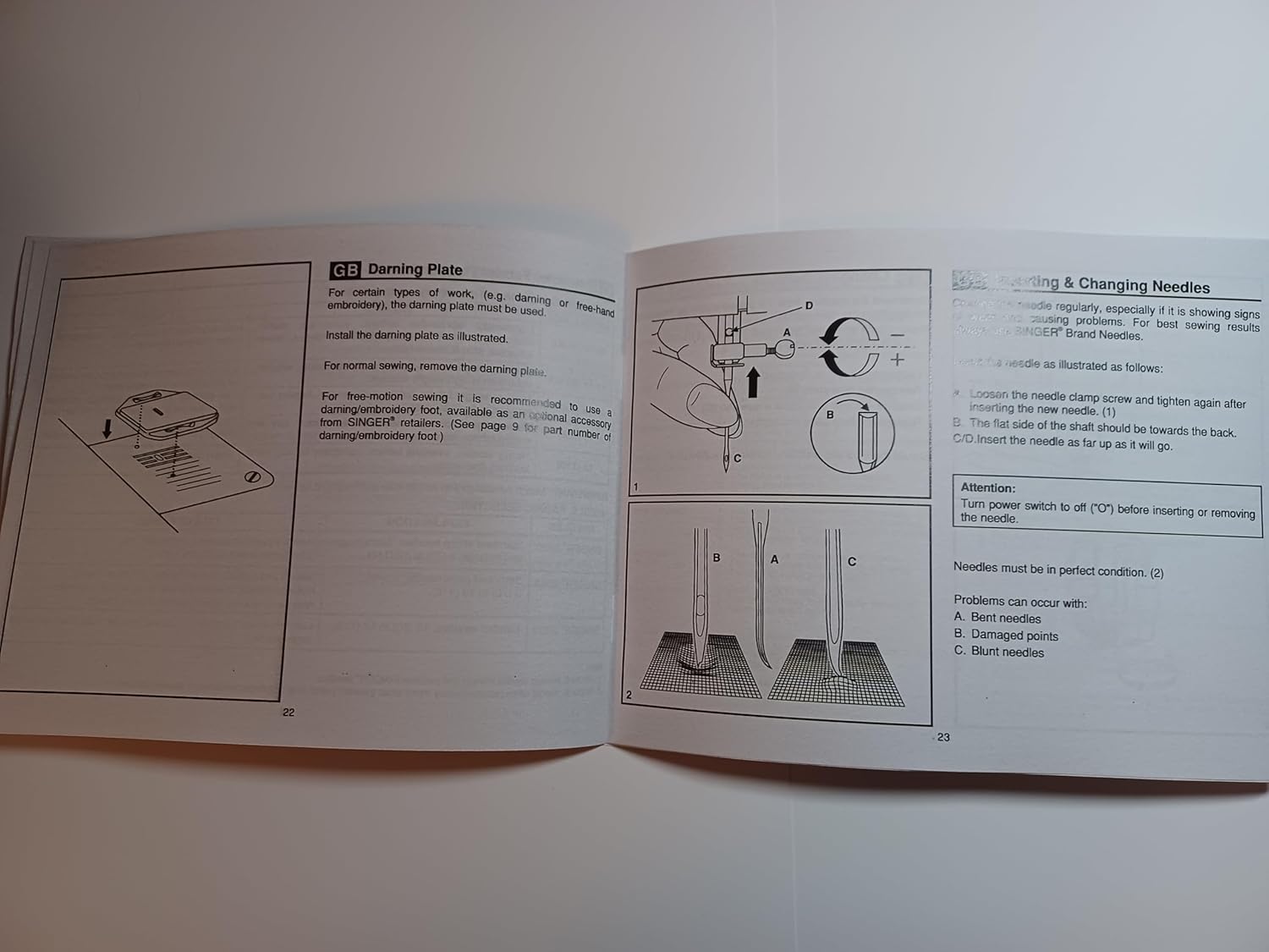 Page from Singer 2250 manual showing sewing on buttons, extension table, darning plate, and needle changing