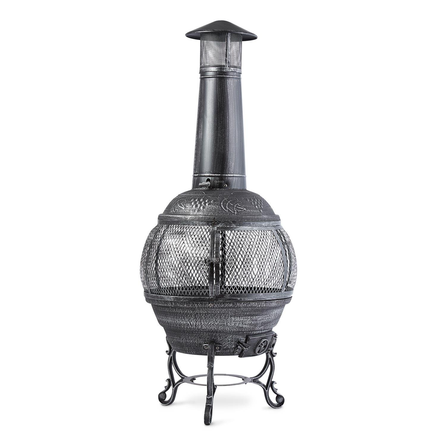Blumfeldt Flavius - Chimenea Exterior, Hierro Fundido, 140 cm Altura, diseño Antiguo, brasero terraza Apto Carbon o leña, Fuego Circular, Incluye atizador y Parrilla, Plateado