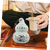 Vista 9 de Tarro de almacenamiento de cerámica en forma de calabaza de té, tarros de café con tapas, decoración de conejo, almacenamiento de té de porcelana