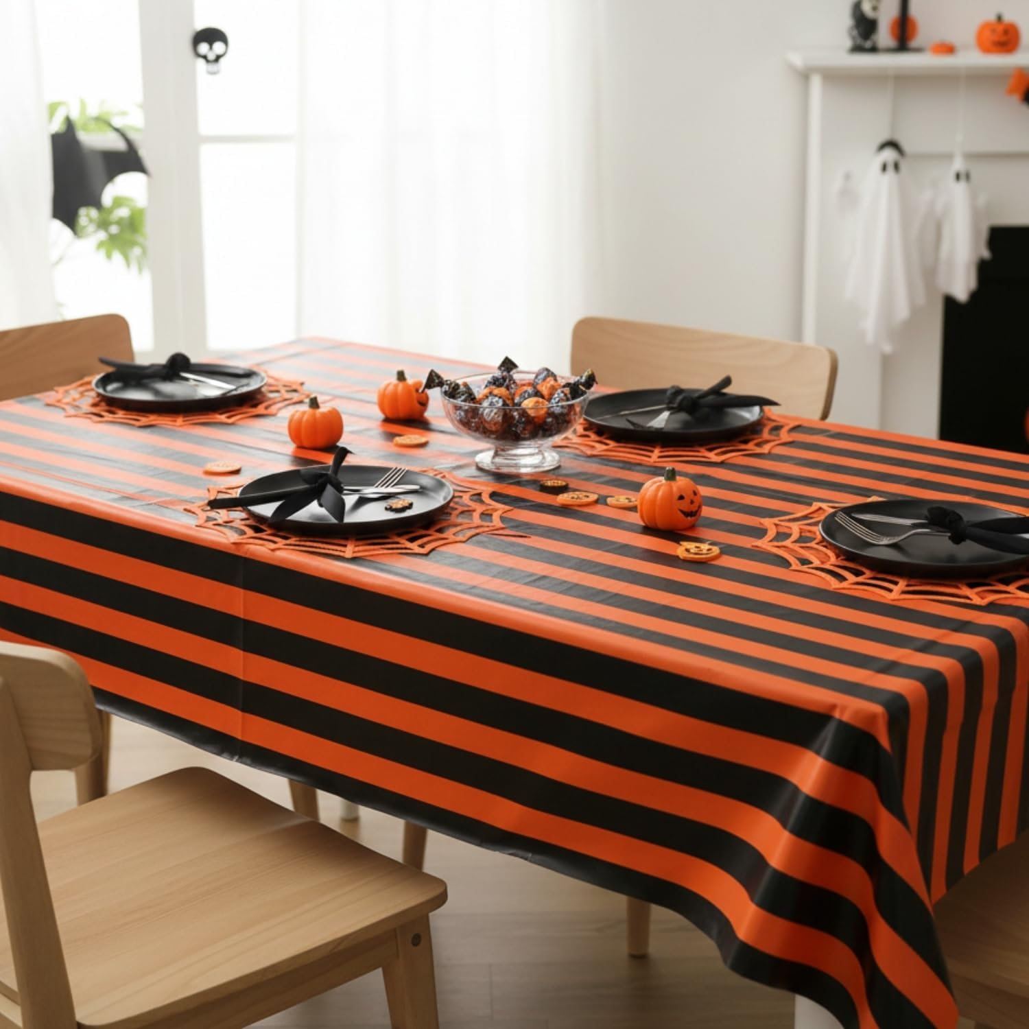 Fun Express 54" x 108" Halloween Orange & Black Striped Disposable Plastic Tablecloth