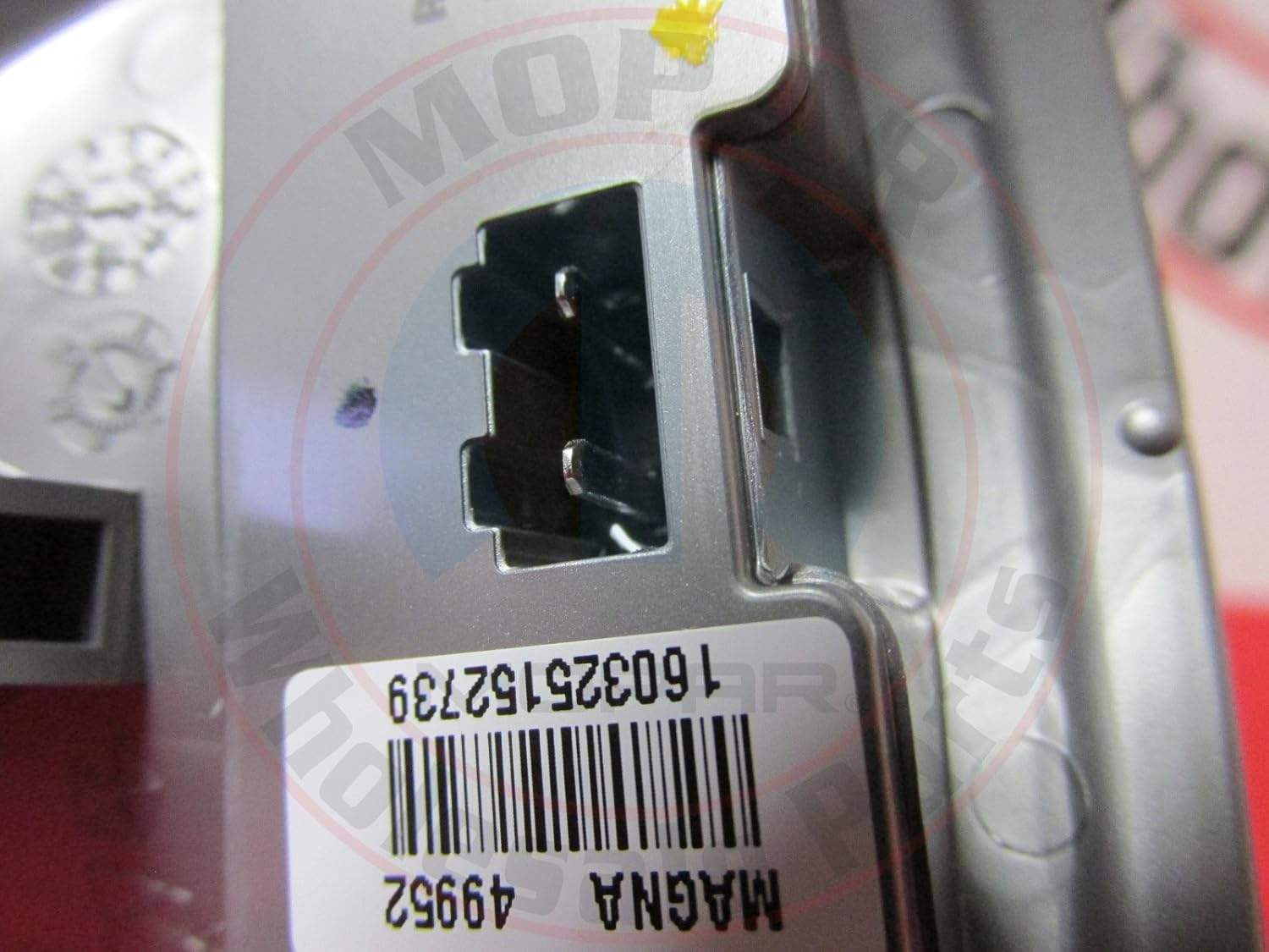 Close-up of the electrical connector on the back of the Mopar 68302828AA turn signal light.