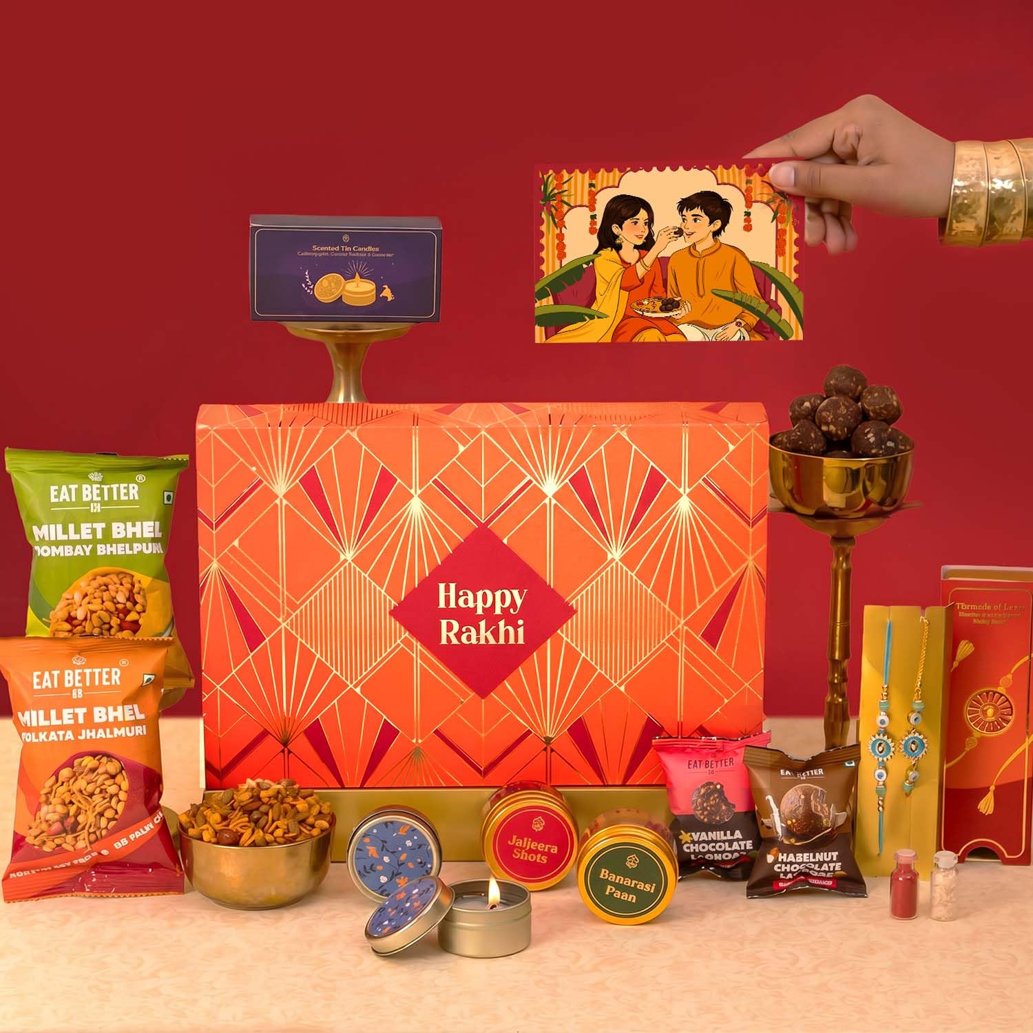 Eat Better Co - Sneh - 12-Item Rakhi Gift Hamper For Bhaiya Bhabhi – Hazelnut, Vanilla Chocolate Dry-Fruit Laddoos, Millet Bhel, Evil Eye & Lumba Bracelet | Rakhi for Bhai Bhabhi with Gift Combo Set-image-9