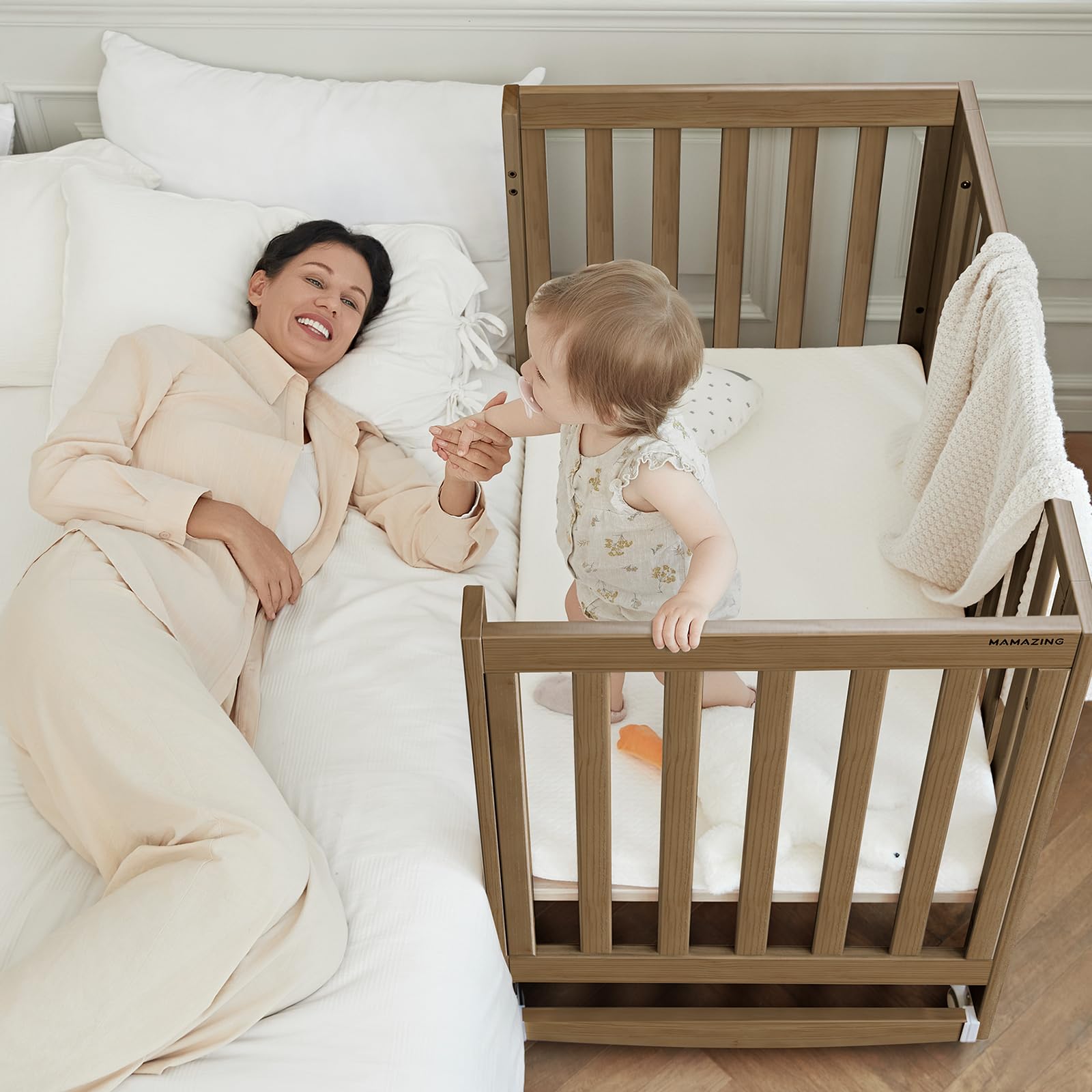 MAMAZING EvoNest Baby Crib, 6 in 1 Convertible Mini Crib with Wheels, 100% New Zealand Pinewood Growing Bed, 4 Adjustable Mattress Height?Walnut Brown