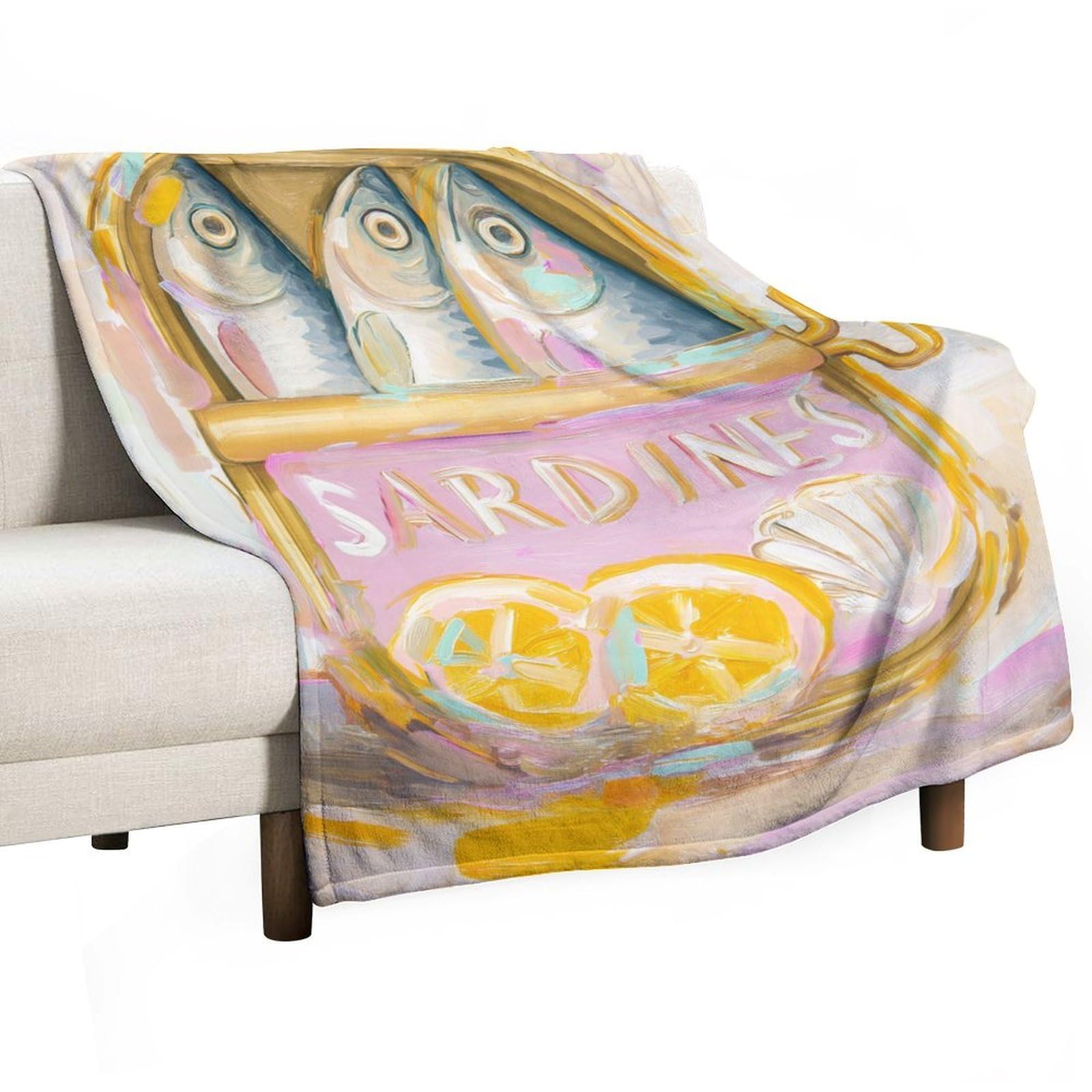 Couverture sardine colorée pour cocooning sur le canapé du salon