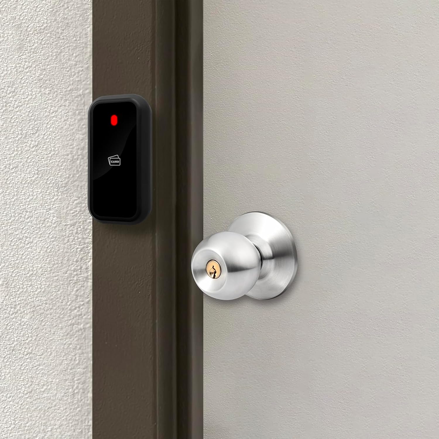 RFID reader installed on a door frame next to a door handle.