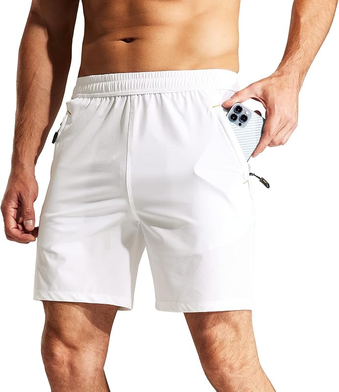 MIER Pantalones cortos deportivos de 7 pulgadas para hombre con 3 bolsillos con cremallera, ajuste seco | Ropa de ejercicio de secado rápido para hacer ejercicio, correr, gimnasio y senderismo, cintura elástica ligera, tejido de poliéster reciclado