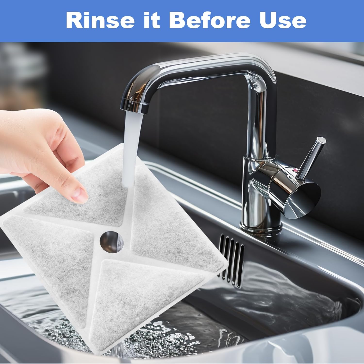 Hand rinsing a square fountain filter under a kitchen faucet