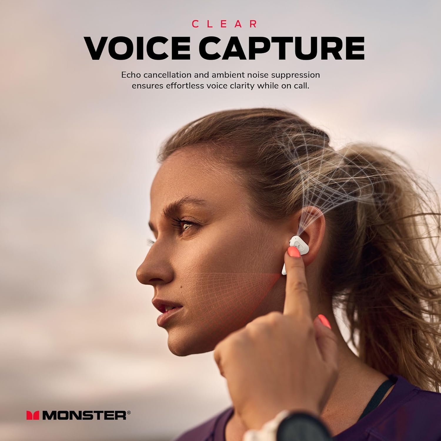 Woman using Monster DNA Go earbuds for a call, illustrating clear voice capture