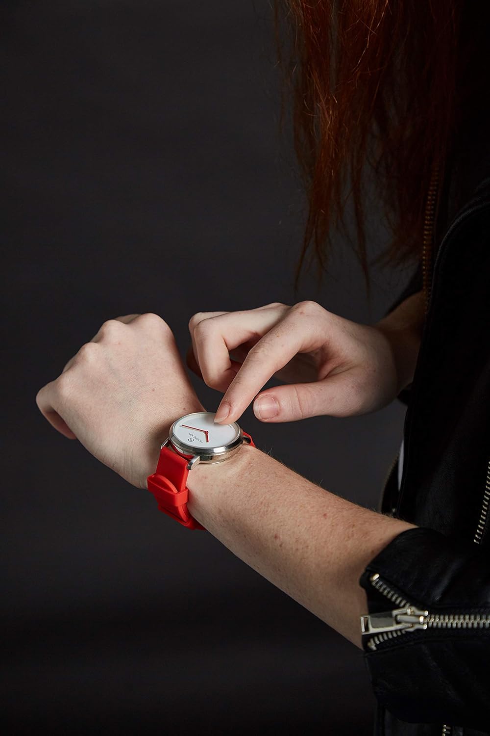 Person adjusting the NOERDEN LIFE2 smartwatch on their wrist