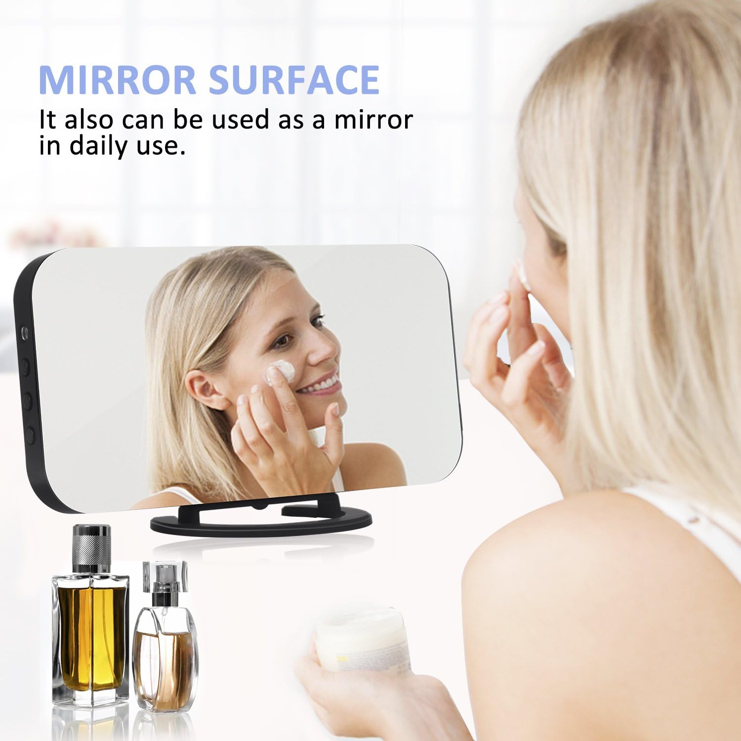 Woman using the alarm clock's mirror surface to apply cream to her face