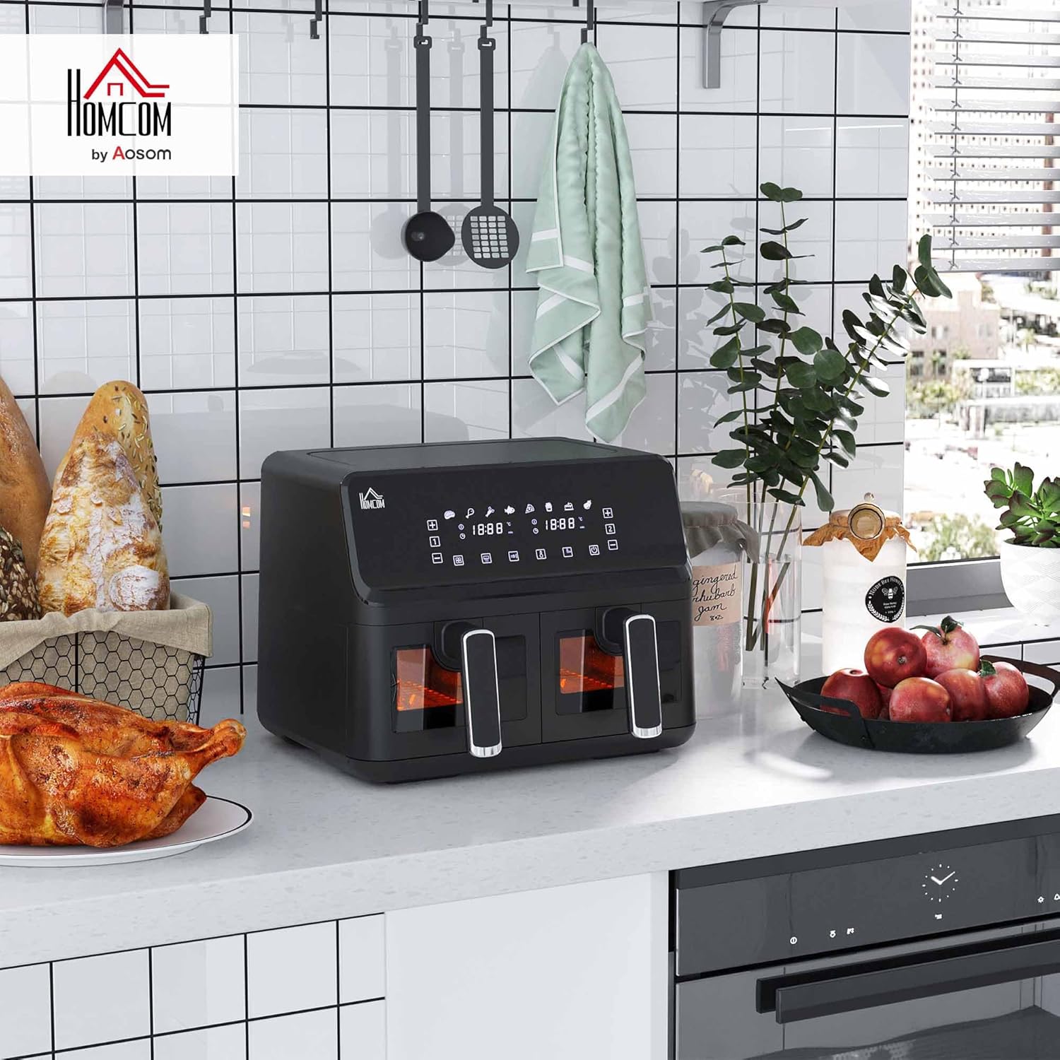 Close-up of the dual baskets of the air fryer, one filled with french fries and the other with chicken nuggets, demonstrating independent cooking capability.