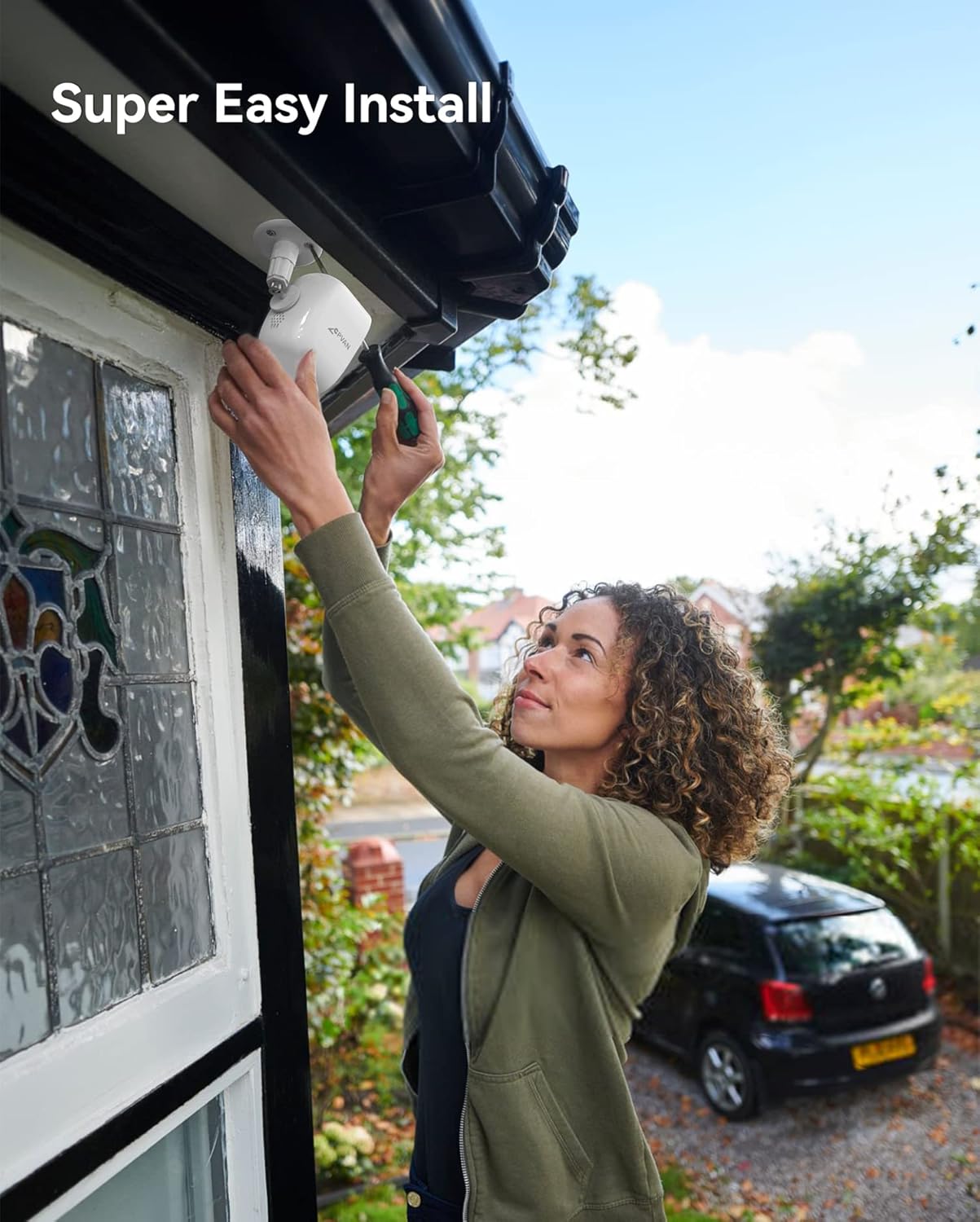 Person installing CPVAN Wireless Security Camera on an outdoor wall