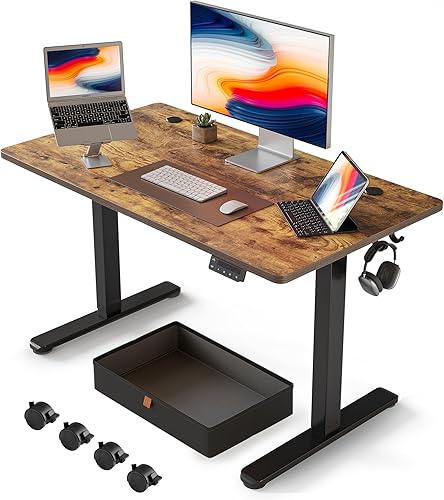 FEZIBO Escritorio de pie de 40 x 24 pulgadas con cajón, escritorio eléctrico de altura ajustable, escritorio de oficina en casa, estación de trabajo