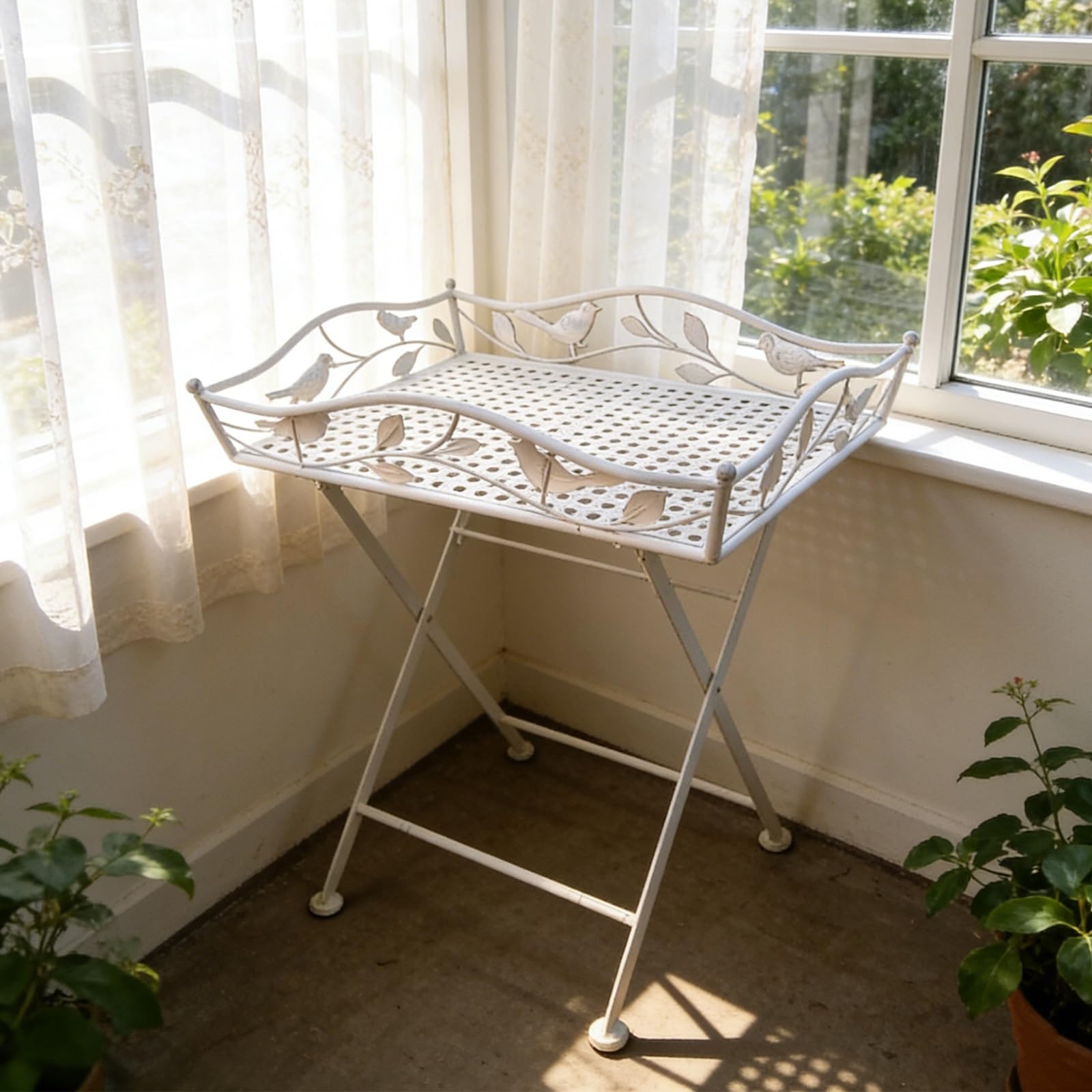 Table pliante en fer forgé anti-encombrement jardin