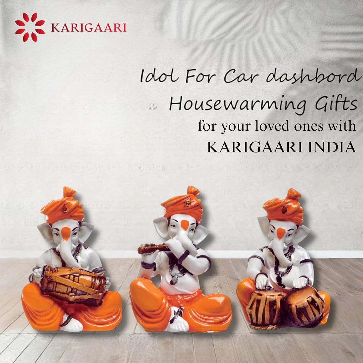Karigaari India Polyresine Orange Dhoti and Turban Ganesha Playing Instruments