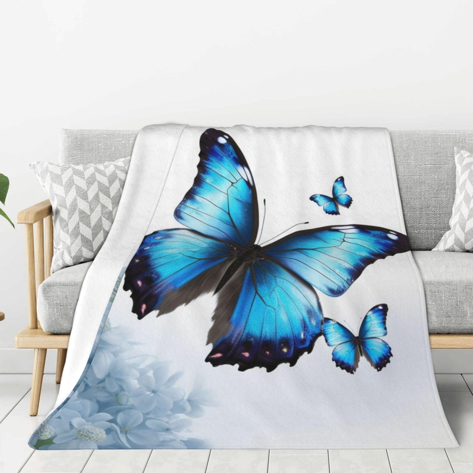 Plaid polaire doux papillon bleu pour cocooning sur le canapé du salon