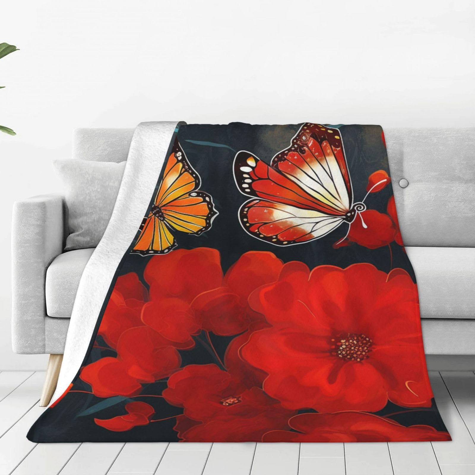 Plaid polaire rouge aux motifs papillons pour vos soirées cocooning au salon