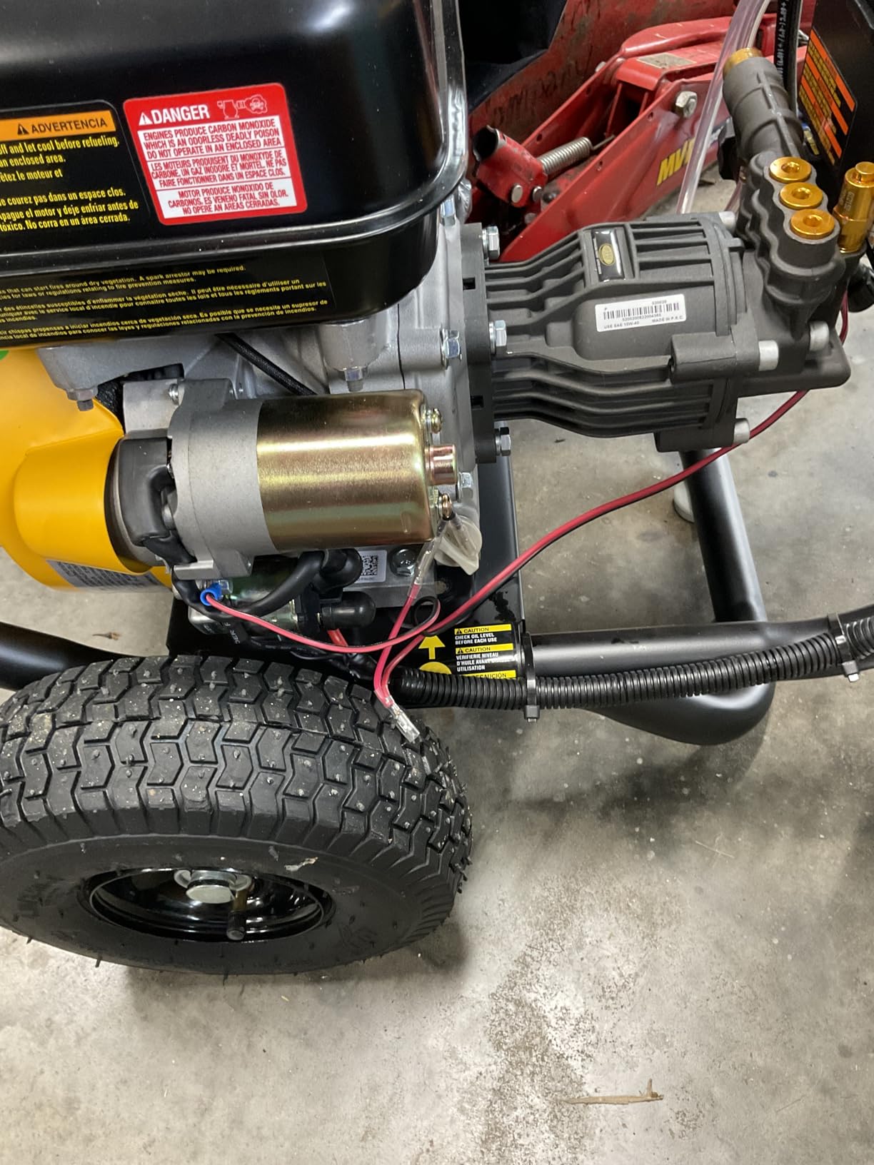 DeWalt DXPW3300-S outdoors on driveway showing full machine in use position
