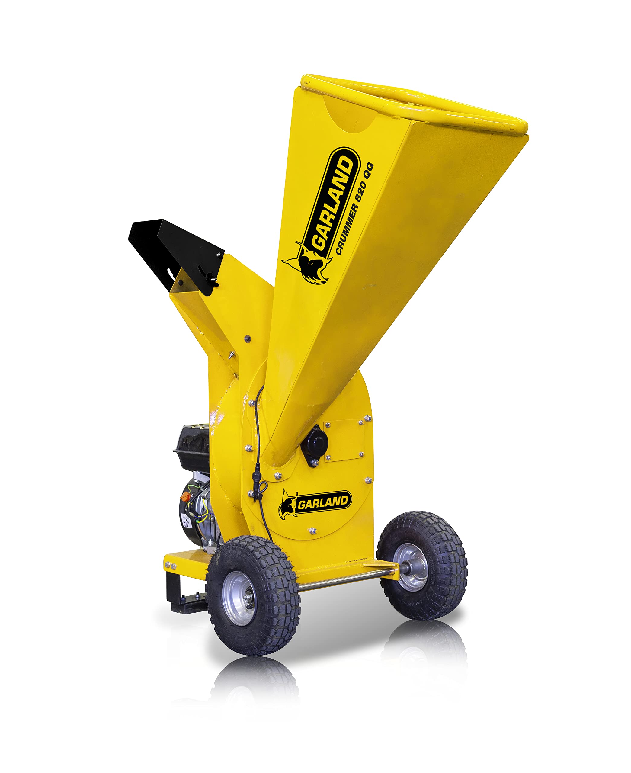 Garland CRUMMER 820 QG-V22 gasoline wood chipper in operation, with a person feeding branches into the hopper.