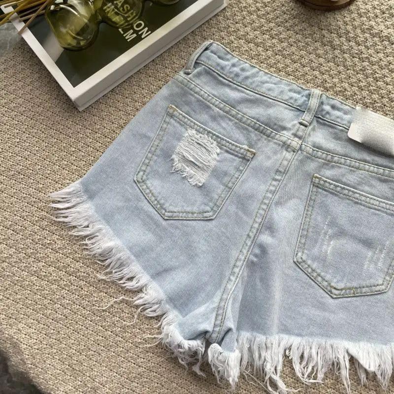 Short en jean taille haute à franges coupe ample et confortable