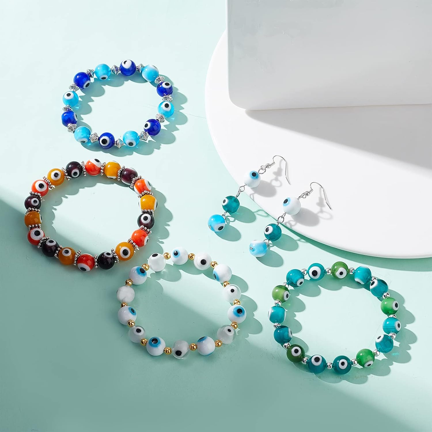 NBEADS 150 Pcs 10mm Glass Evil Eye Beads, 10 Colors, Handmade Lampwork Beads for Bracelets & Necklaces