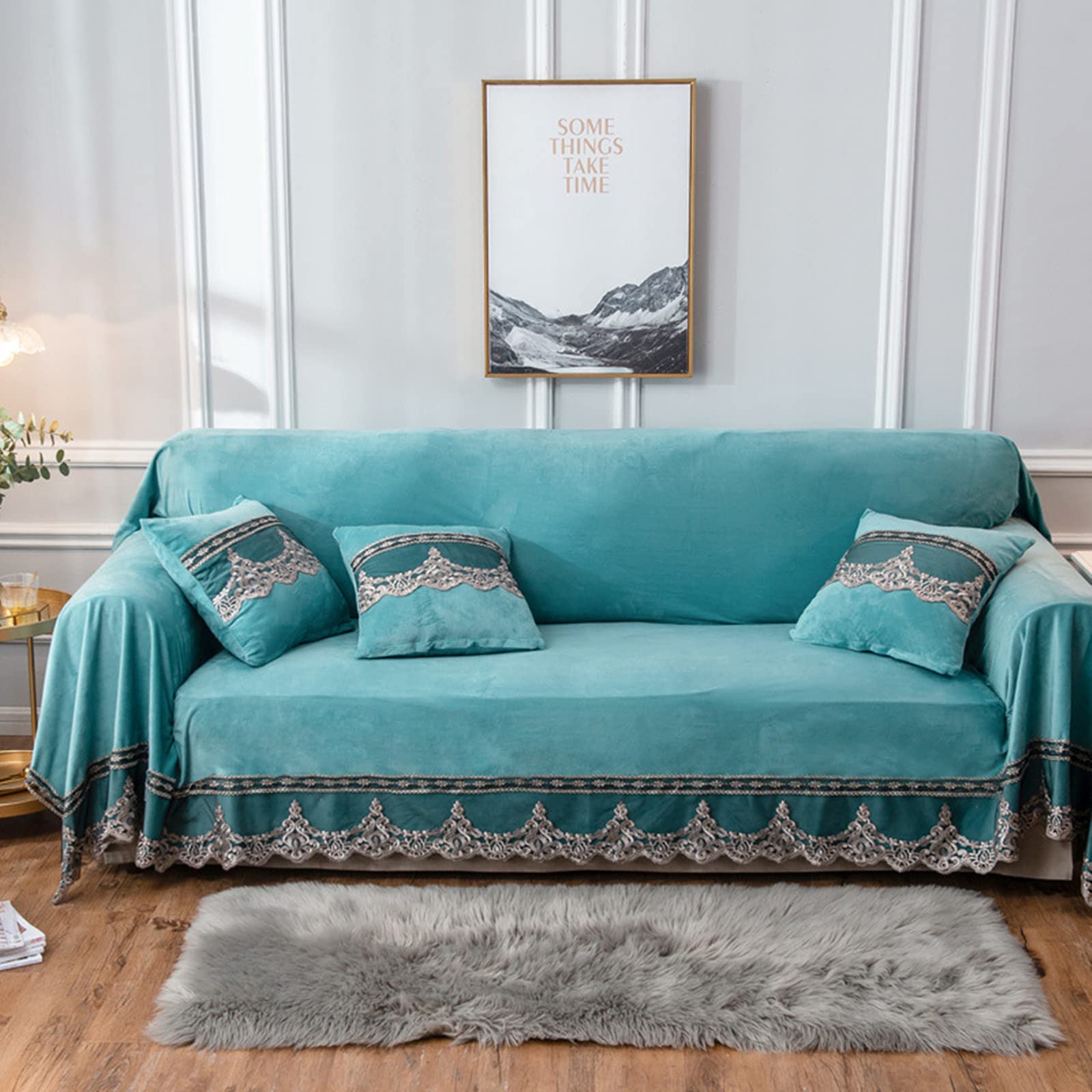 Housse canapé dangle en velours vert pour un salon cocooning en hiver