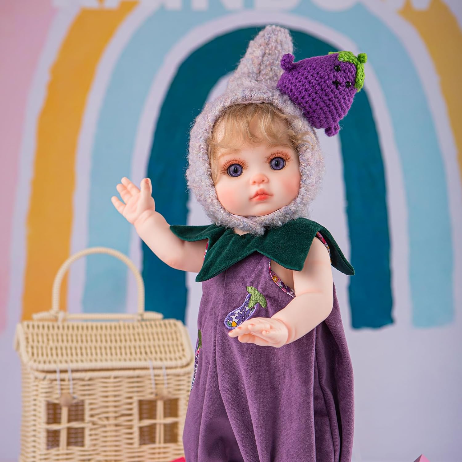 Reborn Baby Doll, Lifelike Realistic Baby Doll with Purple Eggplant Hat and Cute Outfit, 18inch Soft Vinyl Doll for 3+Years Old and Collectors