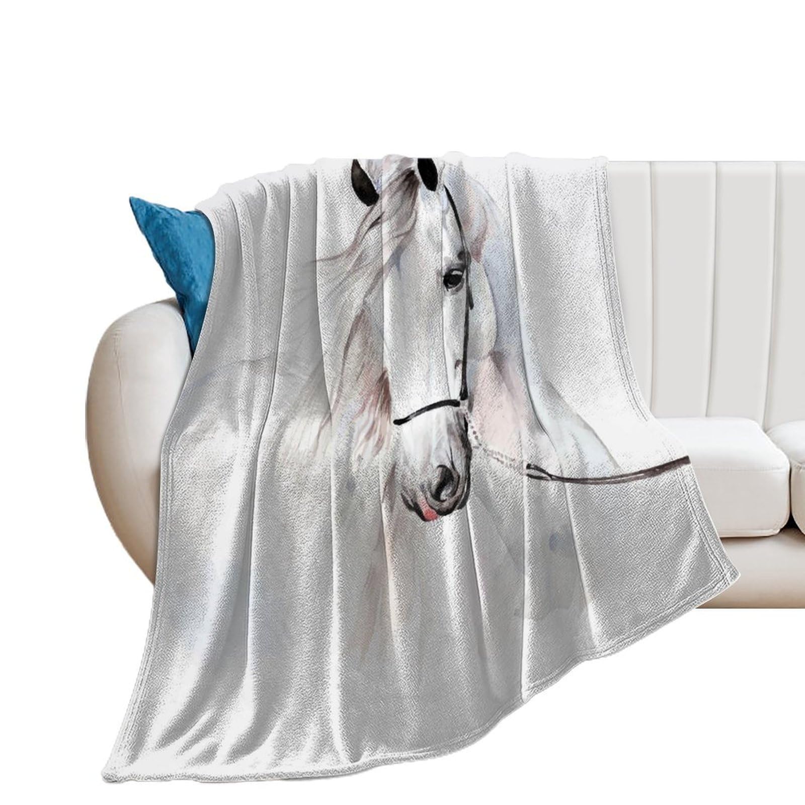 Couverture polaire cheval blanc pour réchauffer vos soirées cocooning sur le canapé