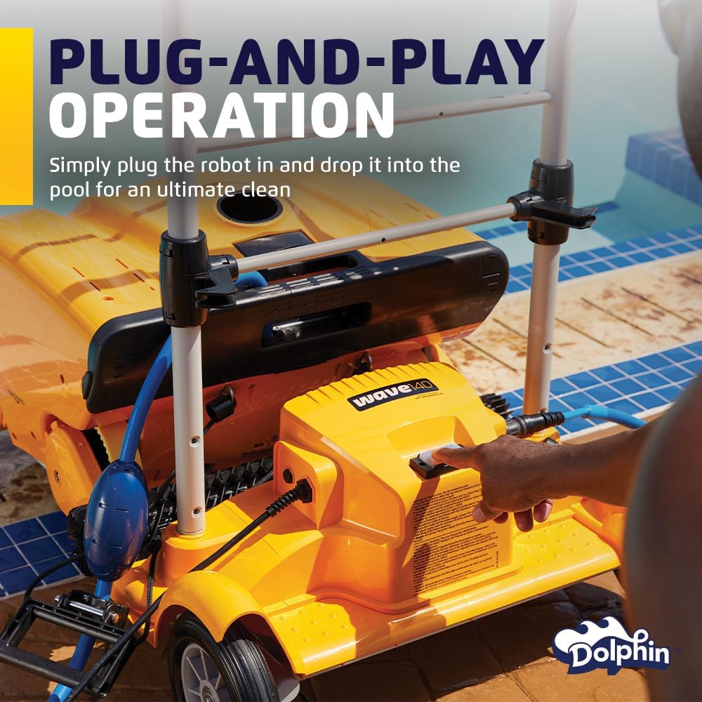 Dolphin Wave 140 being plugged in on its caddy next to a pool.