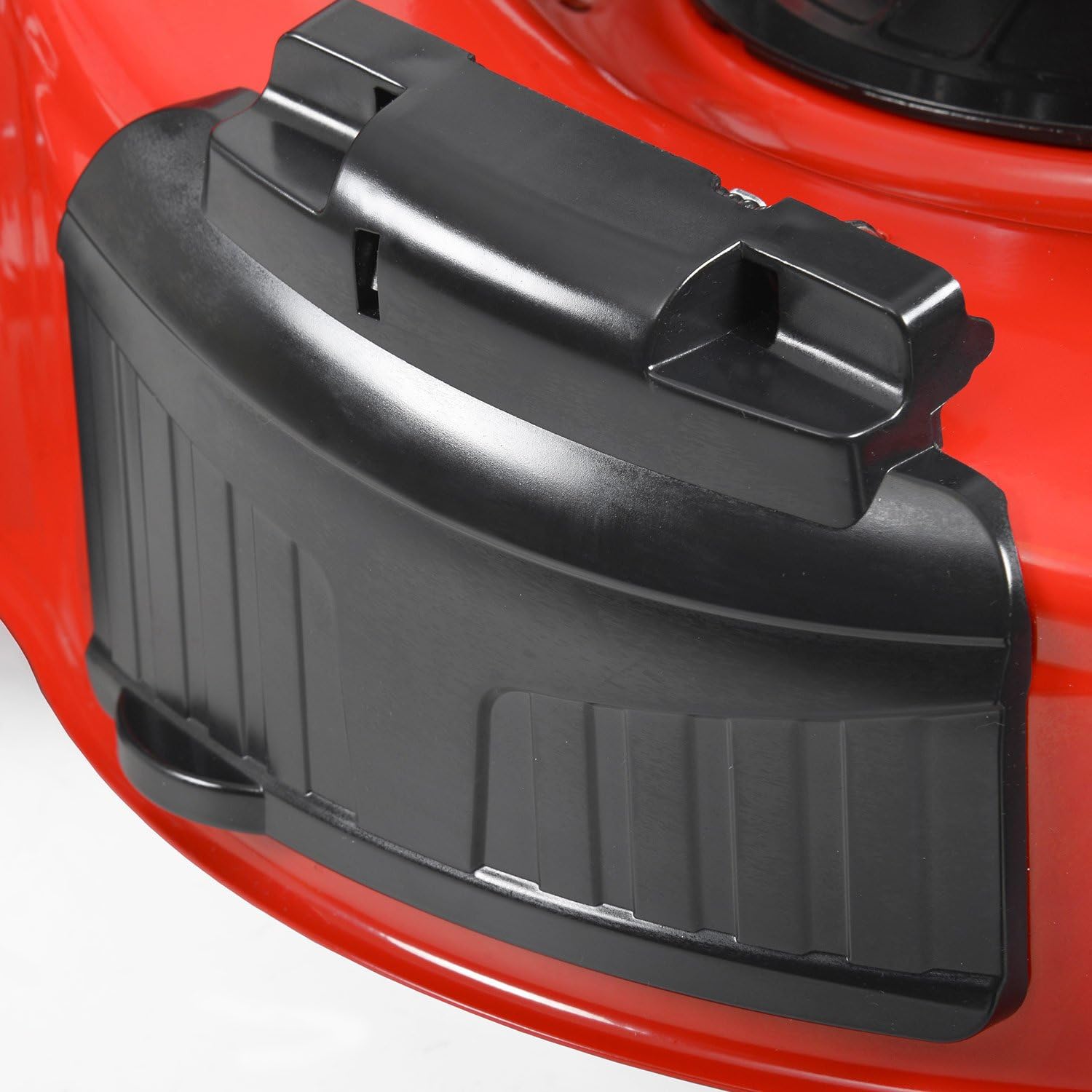 Close-up of the side discharge chute on the Hecht 5564 SXE lawn mower.