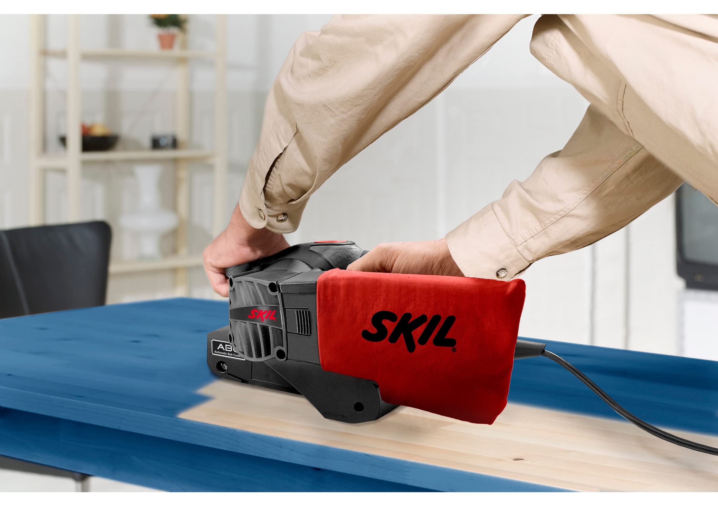 Skil 1210AA - Lijadora de banda (650 W, 76 x 457 mm, sistema de centrado automático de banda, bolsa para el polvo, banda de lija)