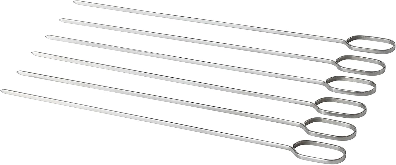 A set of six IKEA 30 cm stainless steel grill skewers laid out on a white surface.