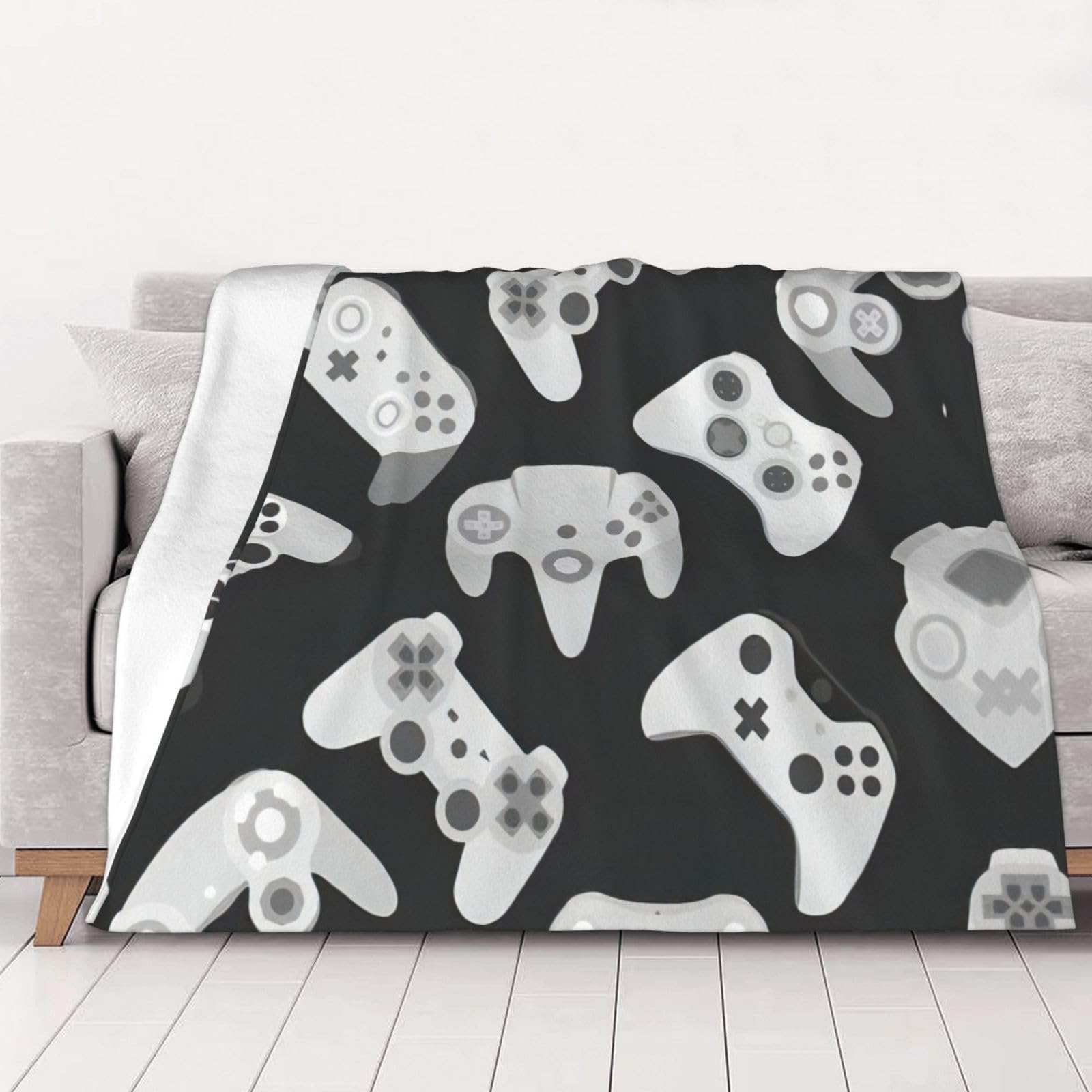 Couverture en flanelle manette de jeu pour vos soirées gaming sur le canapé