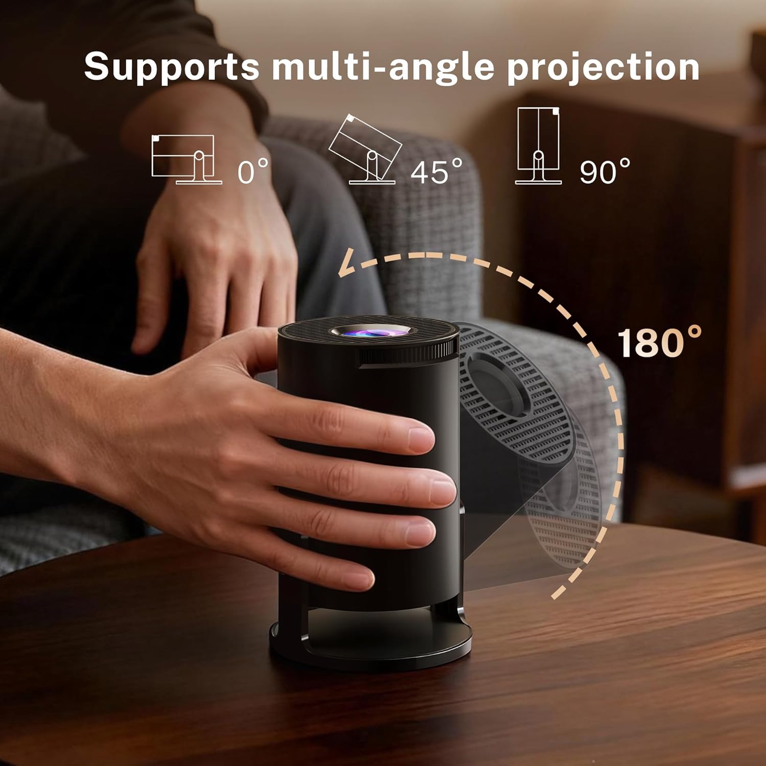 A hand rotating the LYNCAST OptiBarrel 500 Projector on its 180-degree stand to project at different angles.