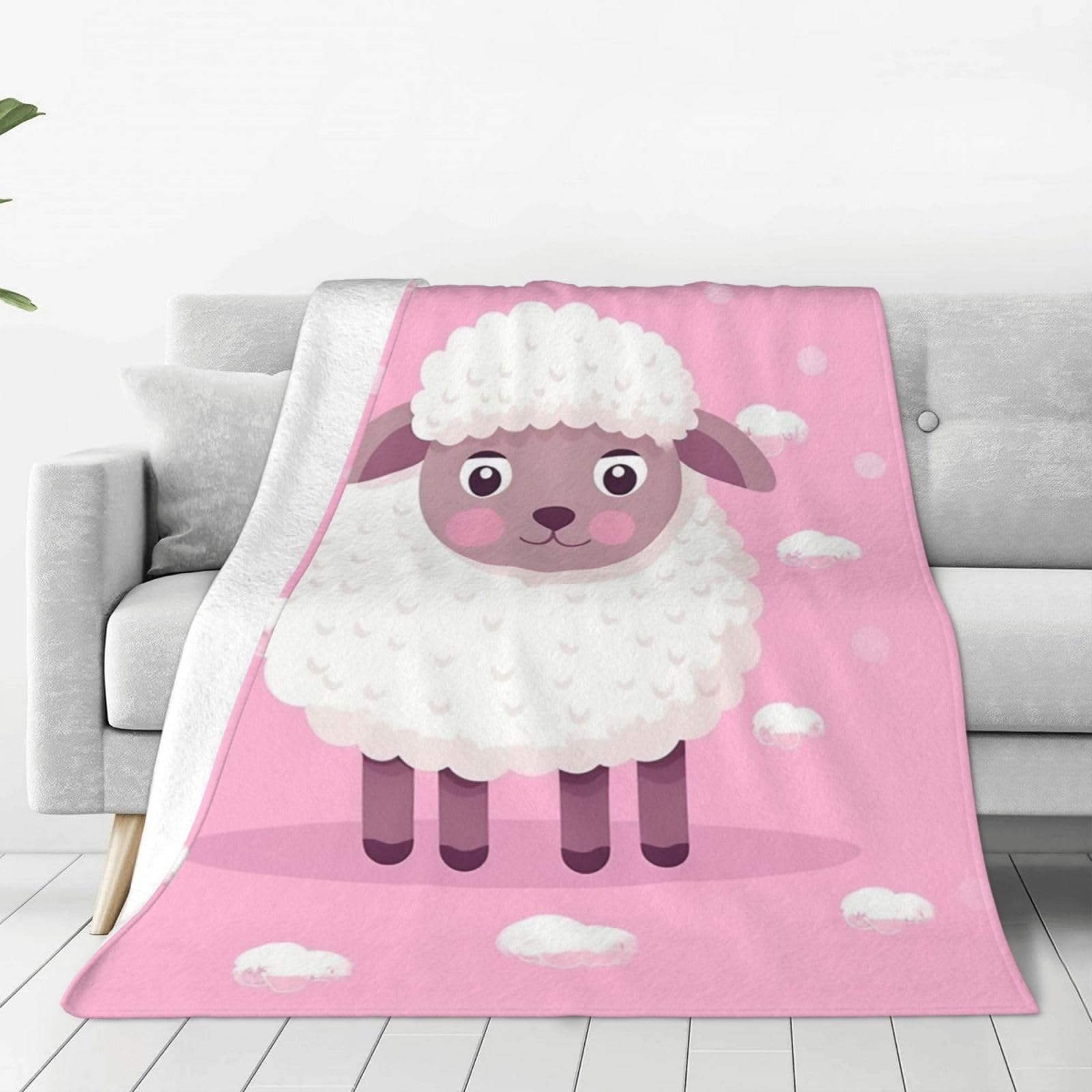 Plaid mouton blanc en micro polaire rose pour cocooning canapé et bureau