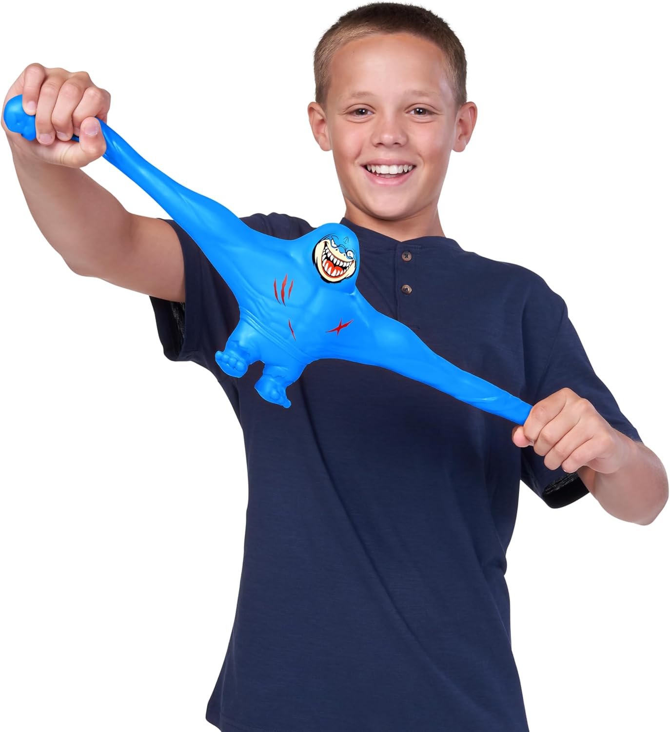 A child stretching the blue ZURU SMASHERS SLAM Heroes Shark toy.