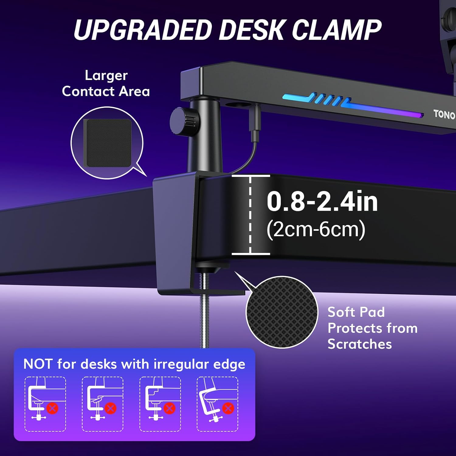 Close-up of the upgraded desk clamp attached to a desk, showing its large contact area and soft pad.