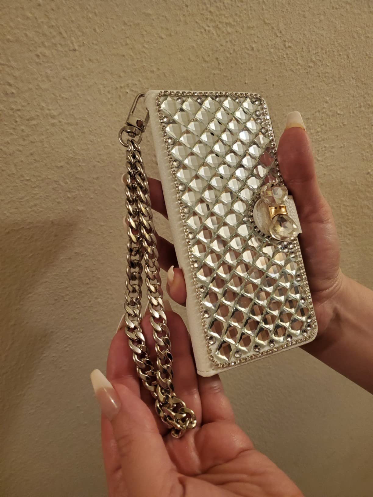 Clutch with detachable chain strap worn hands-free