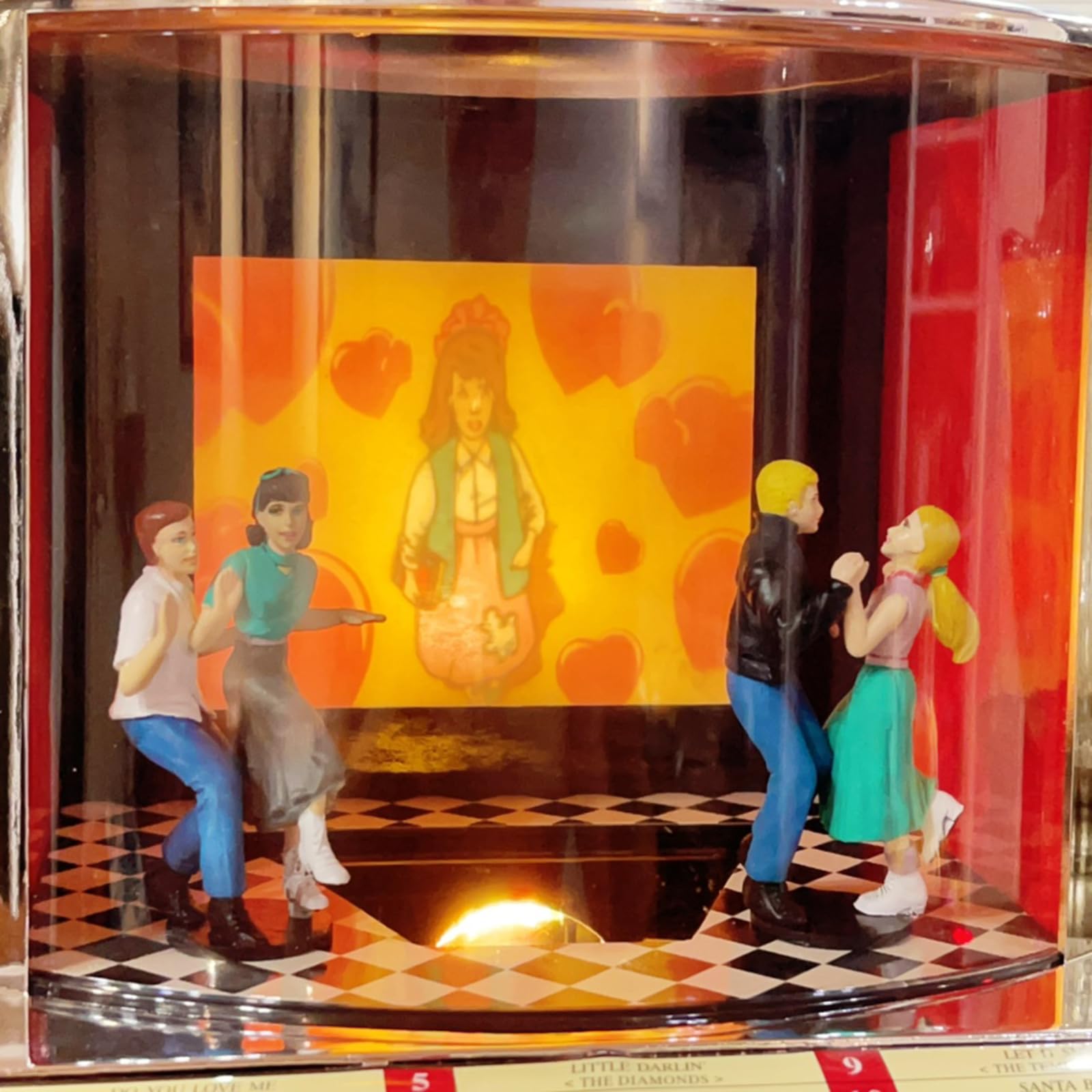 Jukebox retrò con altoparlante integrato e design classico anni '50, riproduce 12 canzoni con presentazioni sincronizzate