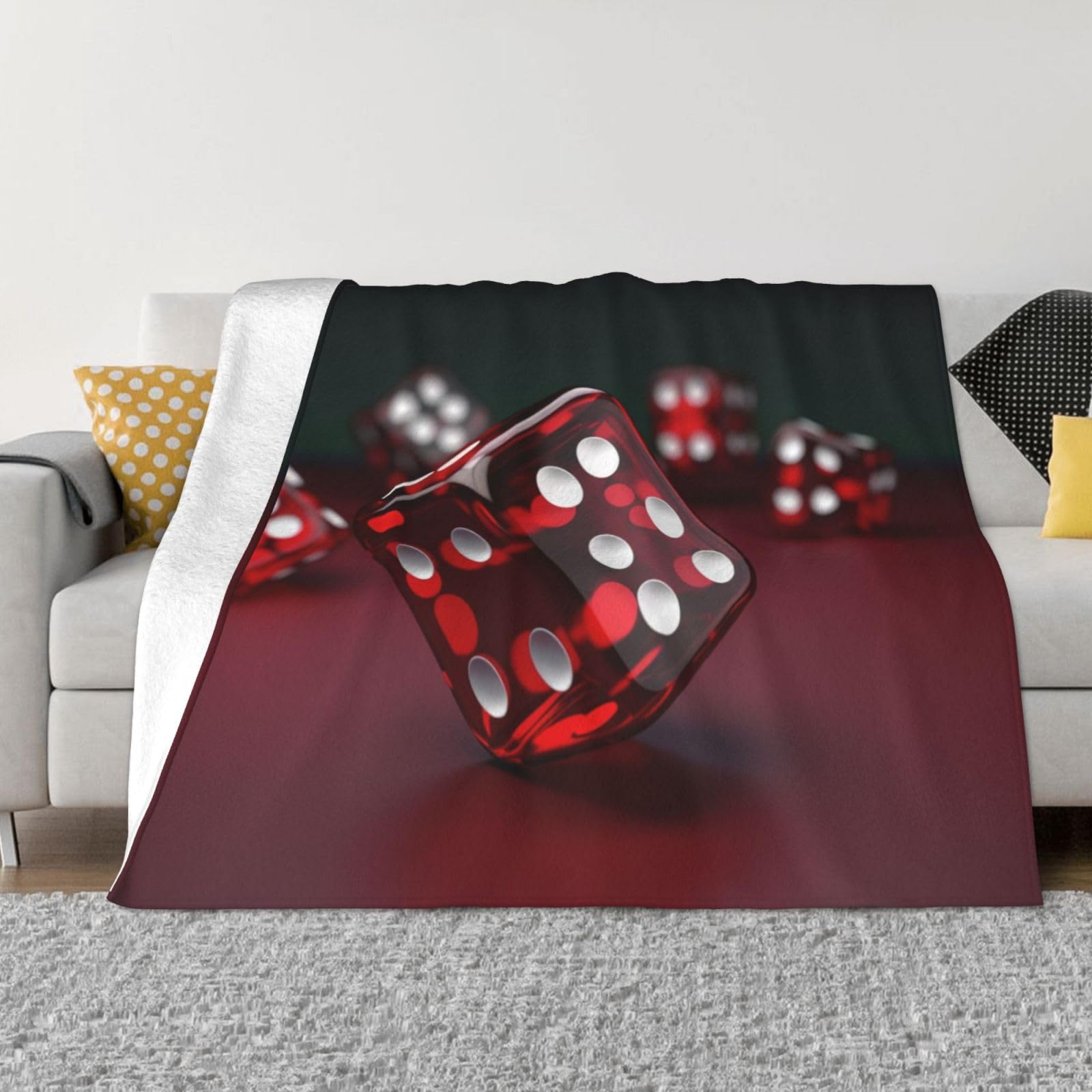 Couverture polaire à dés rouges pour des soirées cocooning réussies sur le canapé